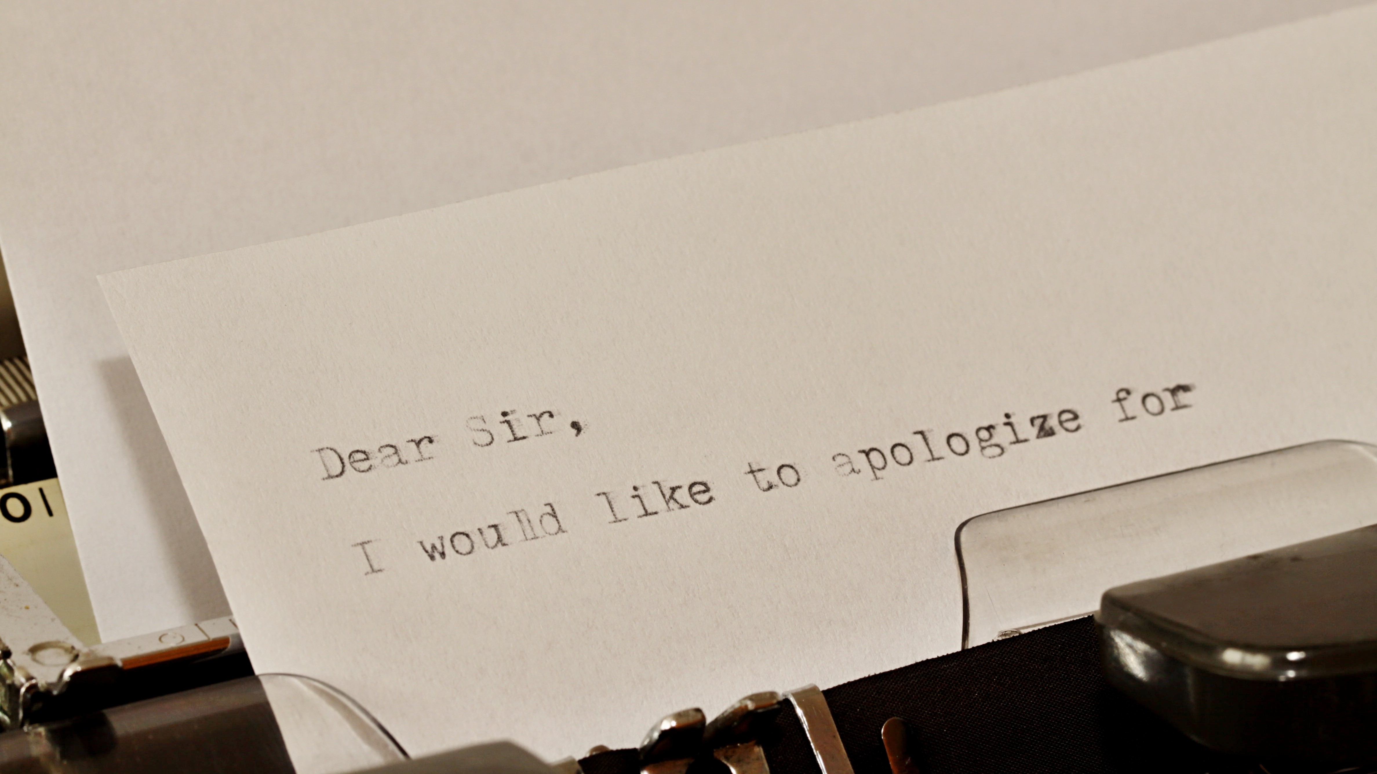 An apology letter being written on a typewriter | Source: Shutterstock