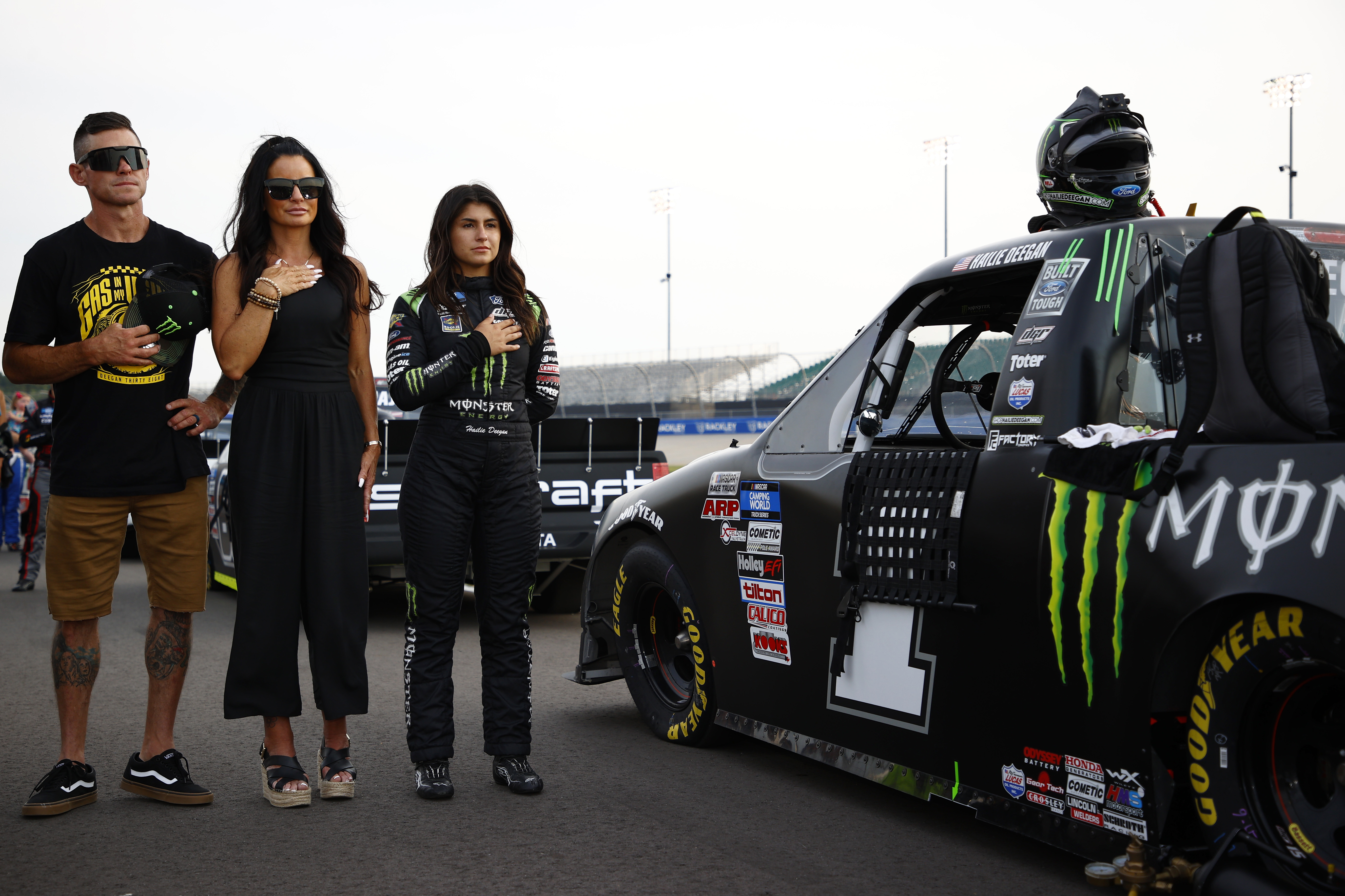 Brian Deegan, Marissa Deegan and Hailie Deegan stand together during the pre-race ceremonies prior to the NASCAR Camping World Truck Series Rackley Roofing 200 at Nashville Superspeedway on June 18, 2021, in Lebanon, Tennessee. | Source: Getty Images
