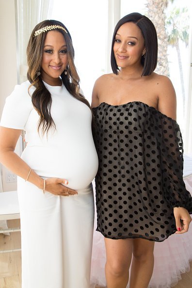 Tamera Mowry-Housley and Tia Mowry at Tamera Mowry-Housley's baby shower on April 4, 2015 | Photo: Getty Images