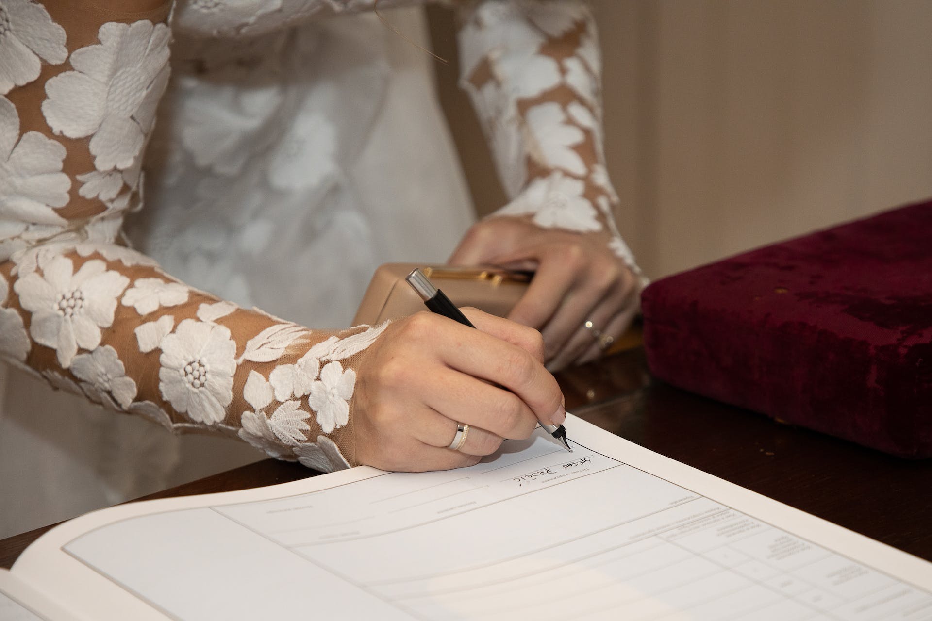 A bride signing a document | Source: Pexels