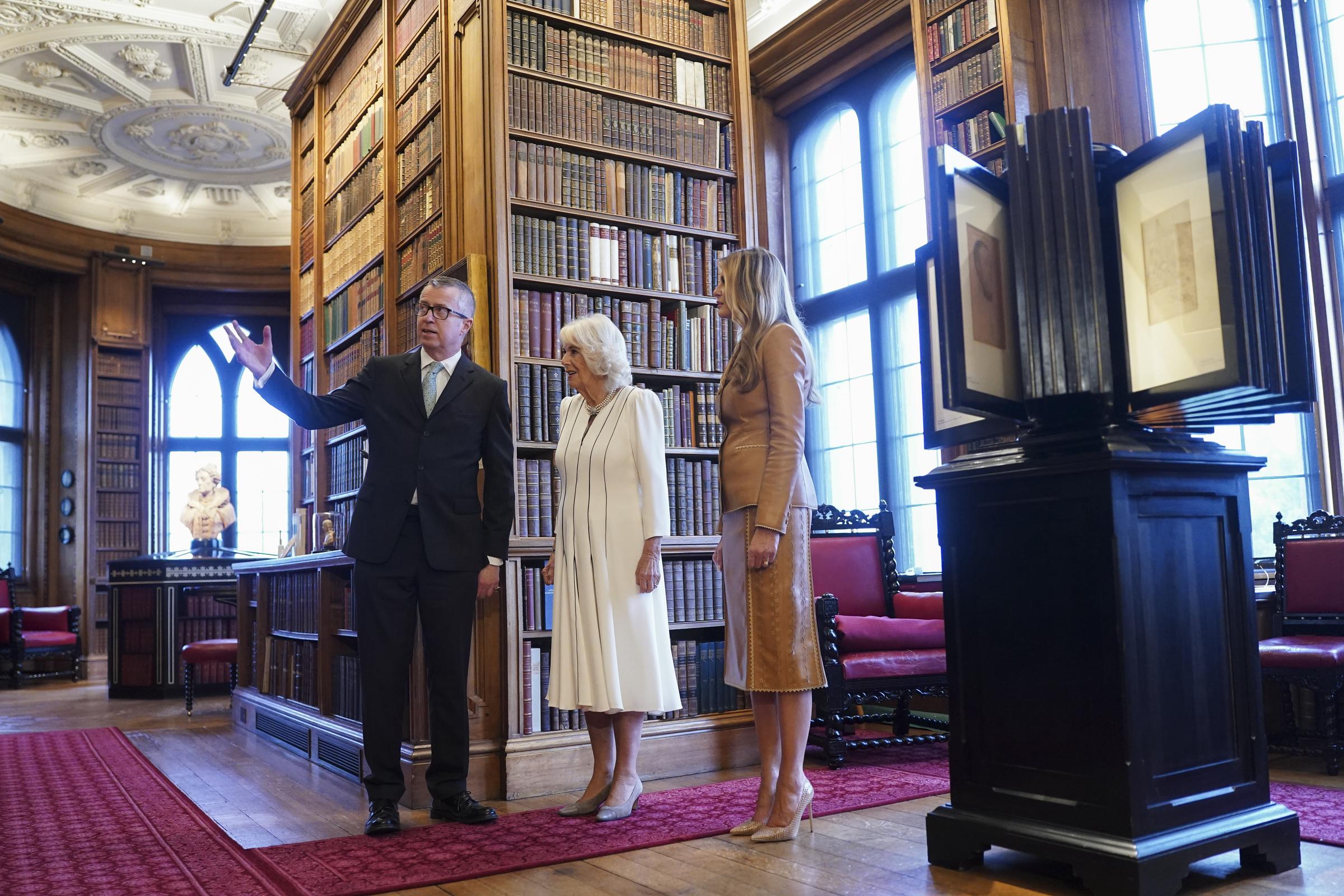 Queen Camilla and First Lady Melania Trump tour the Royal Library, during the U.S State visit in Windsor, England on September 18, 2025 | Source: Getty Images
