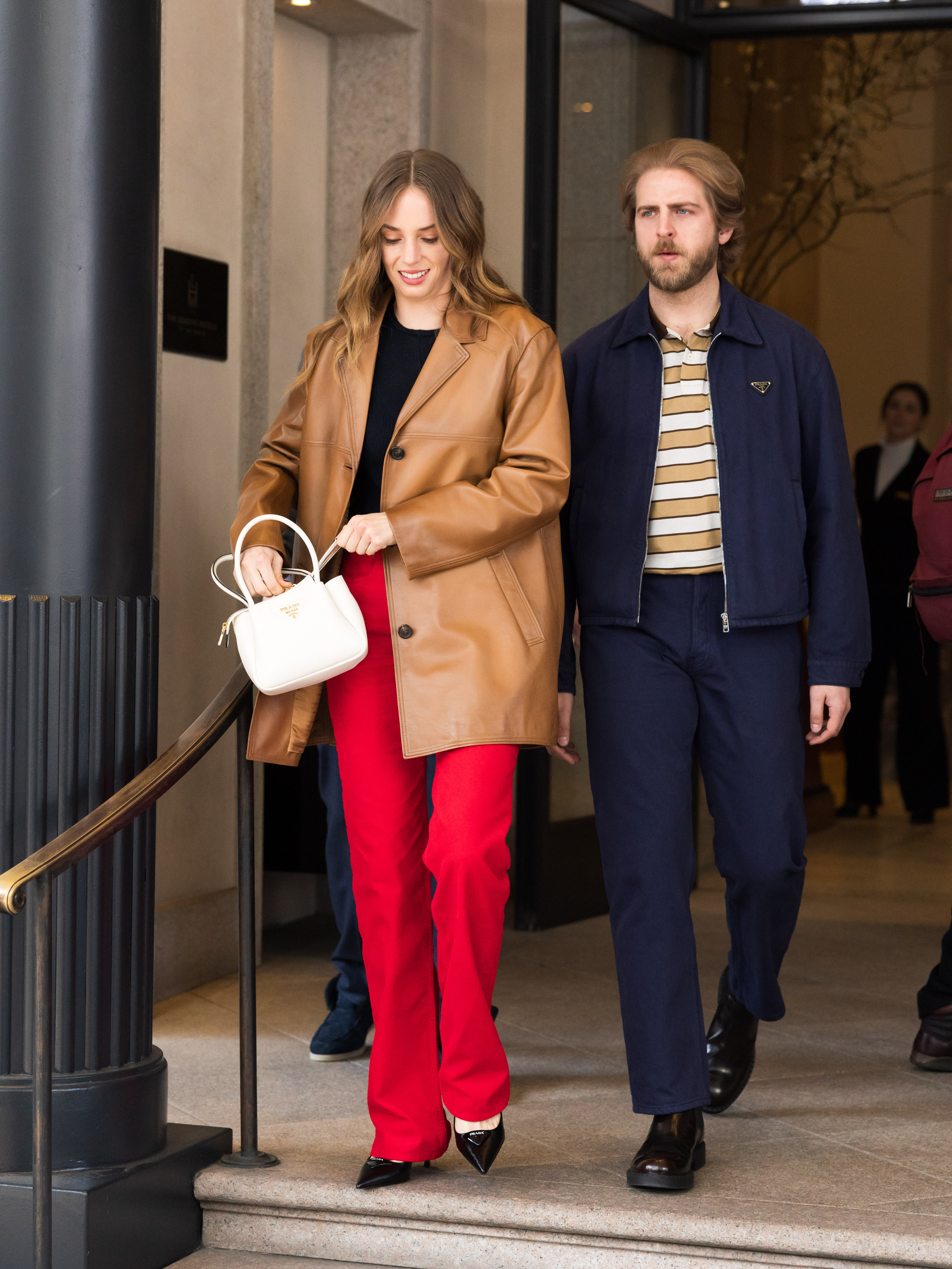 Maya Hawke and Christian Lee Hutson are seen during the Milan Fashion Week Womenswear Fall/Winter show in Italy on February 27, 2025. | Source: Getty Images