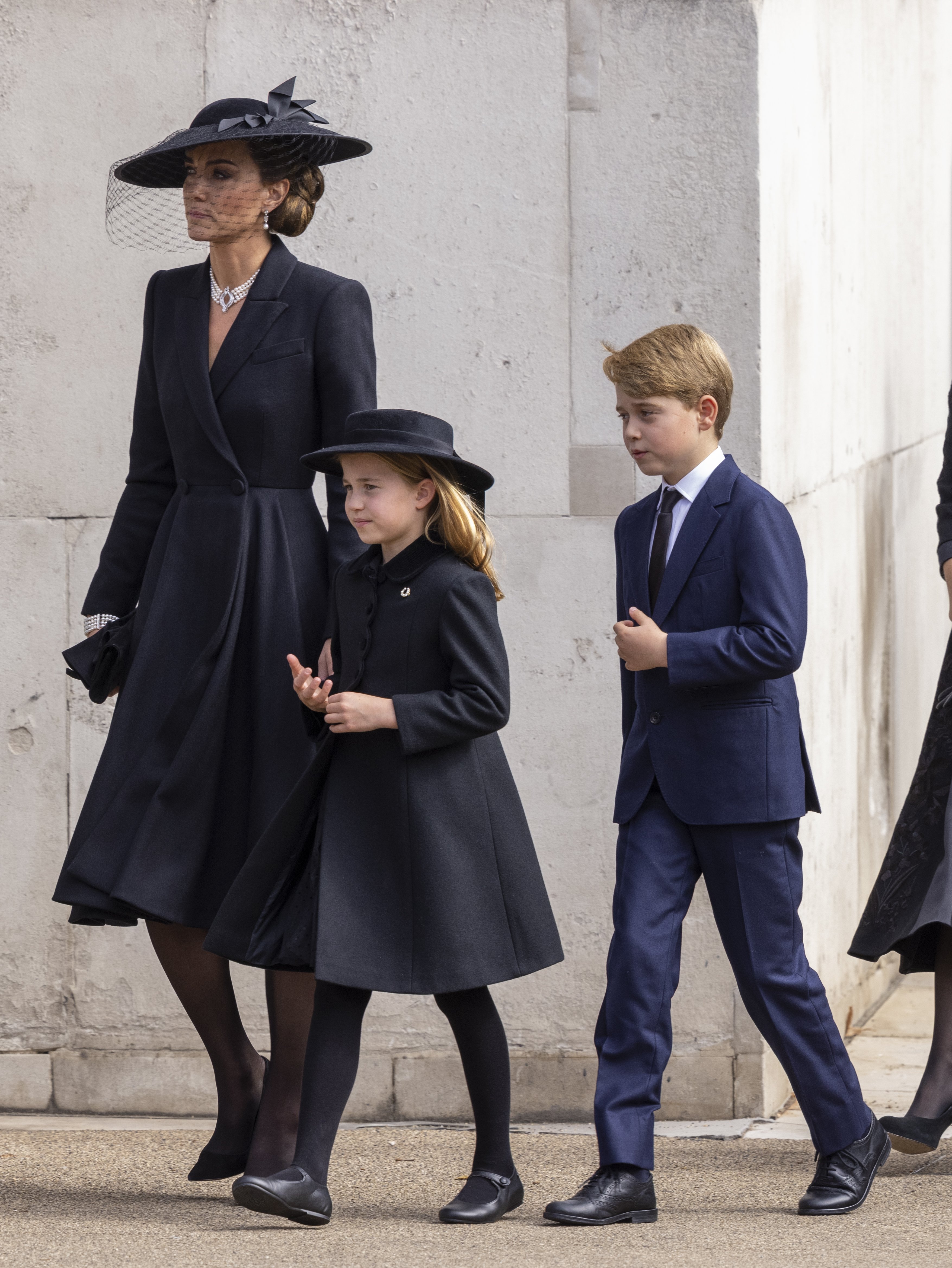Princess Catherine of Wales, Princess Charlotte of Wales, and Prince George of Wales were seen at Wellington Arch, where the coffin of Queen Elizabeth II was transferred to the hearse for the final trip to Windsor after the State Funeral on September 19, 2022, in London, England. | Source: Getty Images 