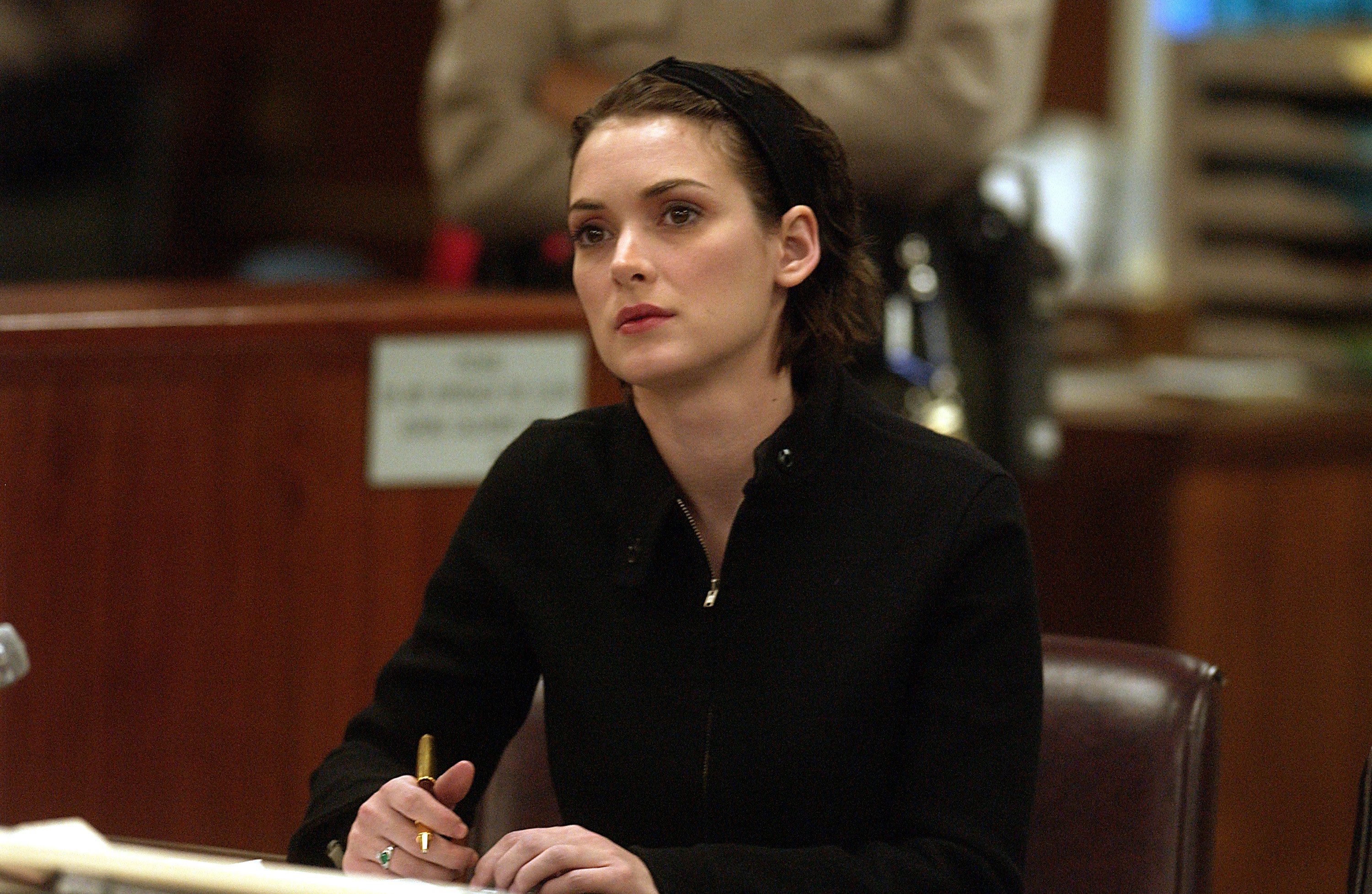 Winona Ryder listens to arguments during the sentencing phase of her shoplifting trial in December, 2002. | Source: Getty Images