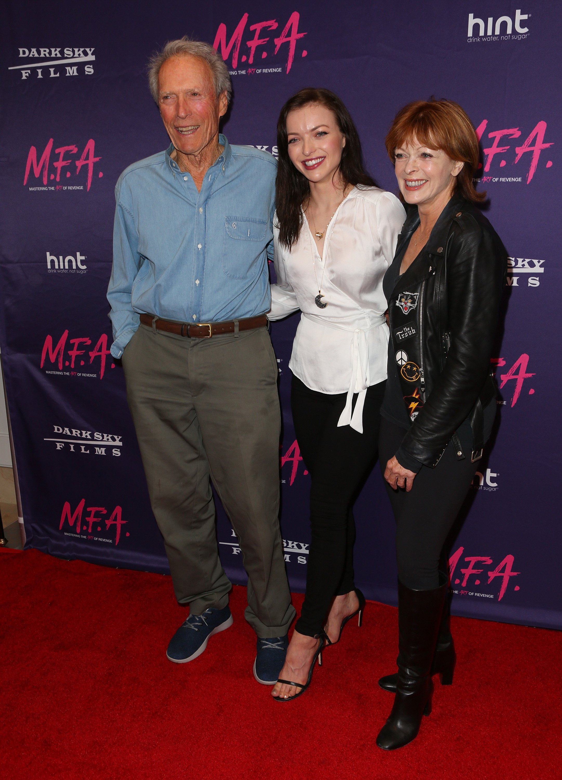 Francesca Eastwood with her father, Clint Eastwood, and her mother, Frances Fisher at the premiere on Francesca's movie, "M.F.A.", October 2017. | Photo: Getty Images. 