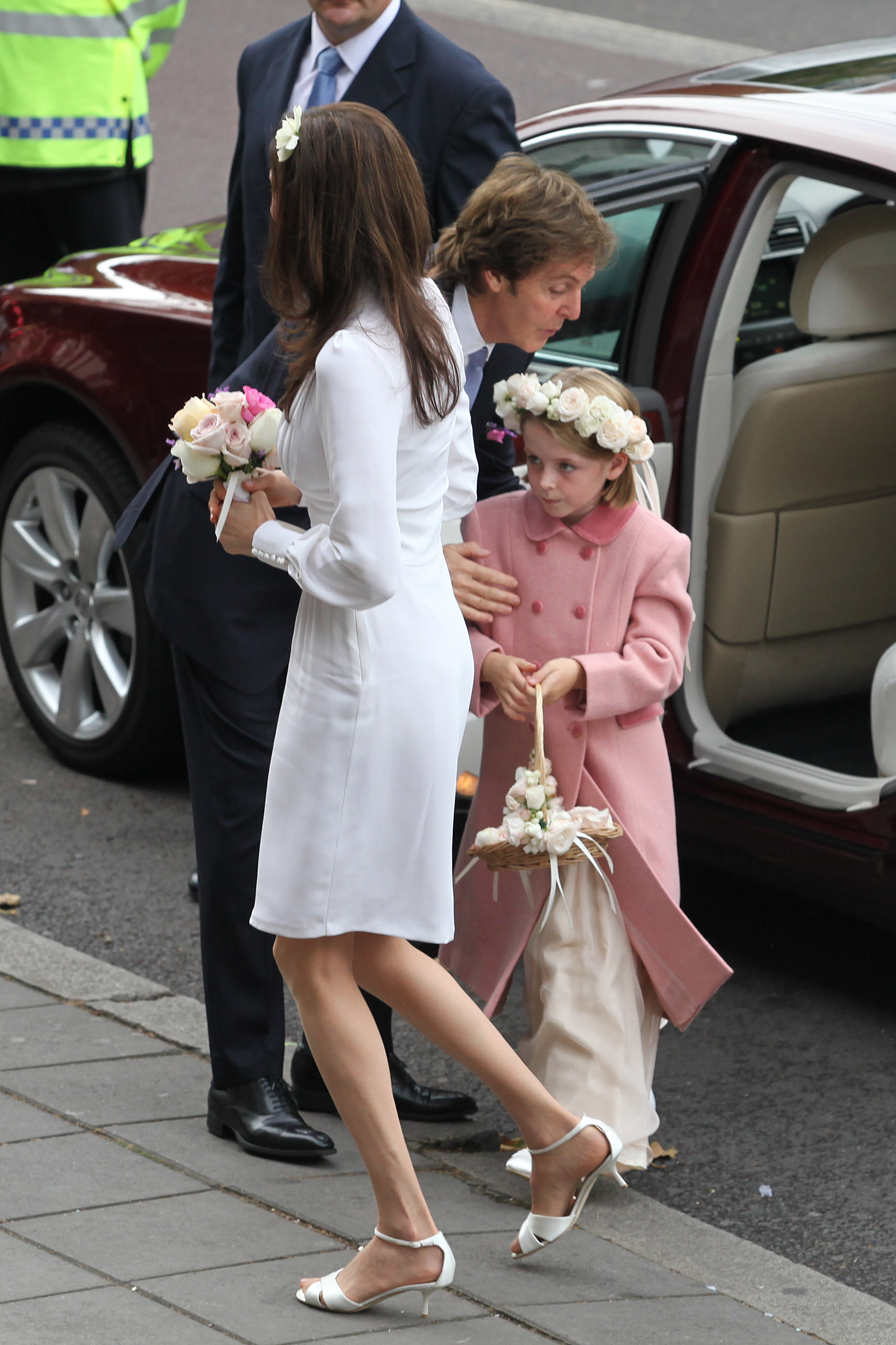 Paul McCartney, Nancy Shevell, and Beatrice McCartney at the Marylebone Registry Office on October 9, 2011, in London | Source: Getty Images