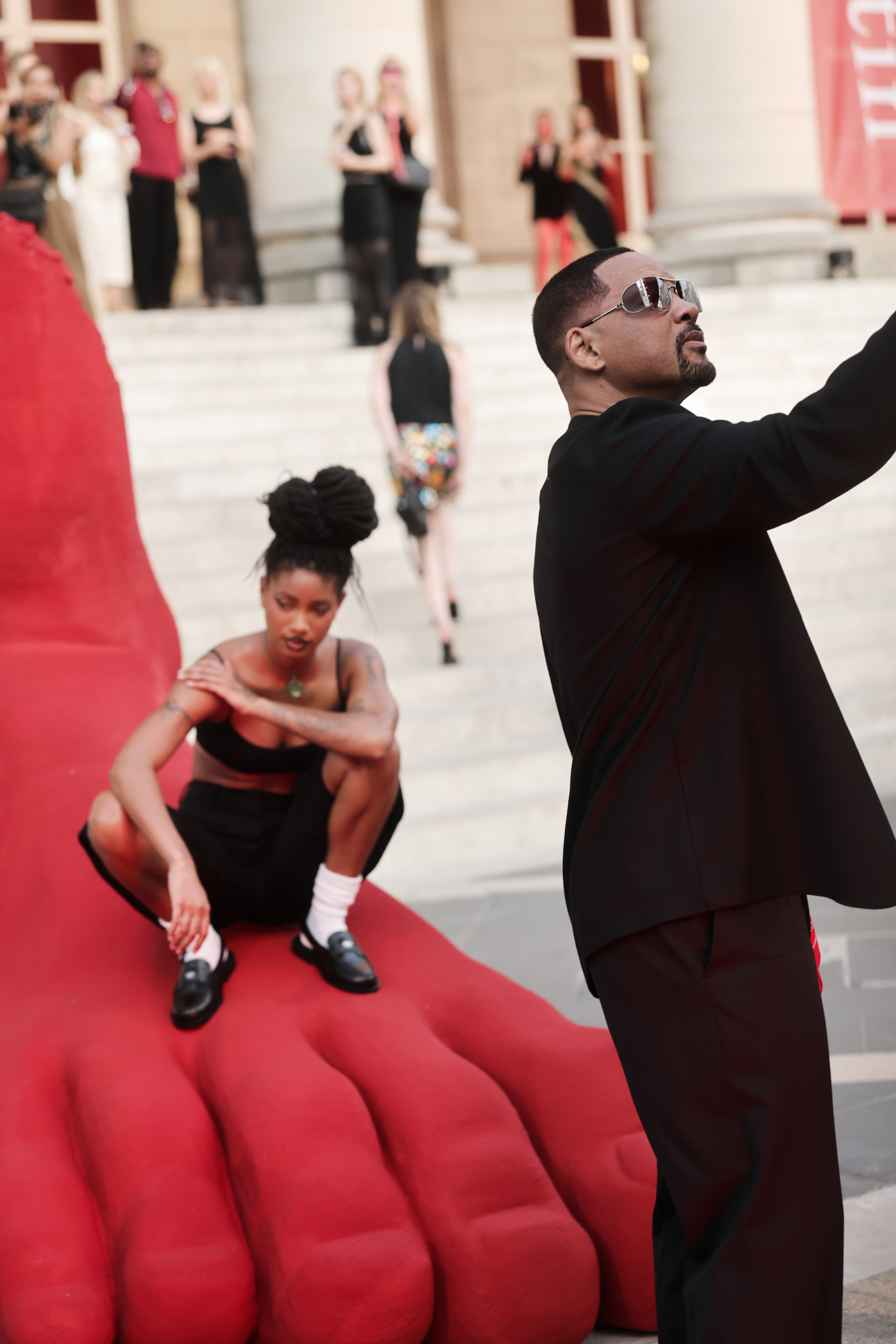 Will Smith took some quirky pictures while Willow Smith appeared in the background, supporting Jaden Smith's special event for Fashion Week. | Source: Getty Images