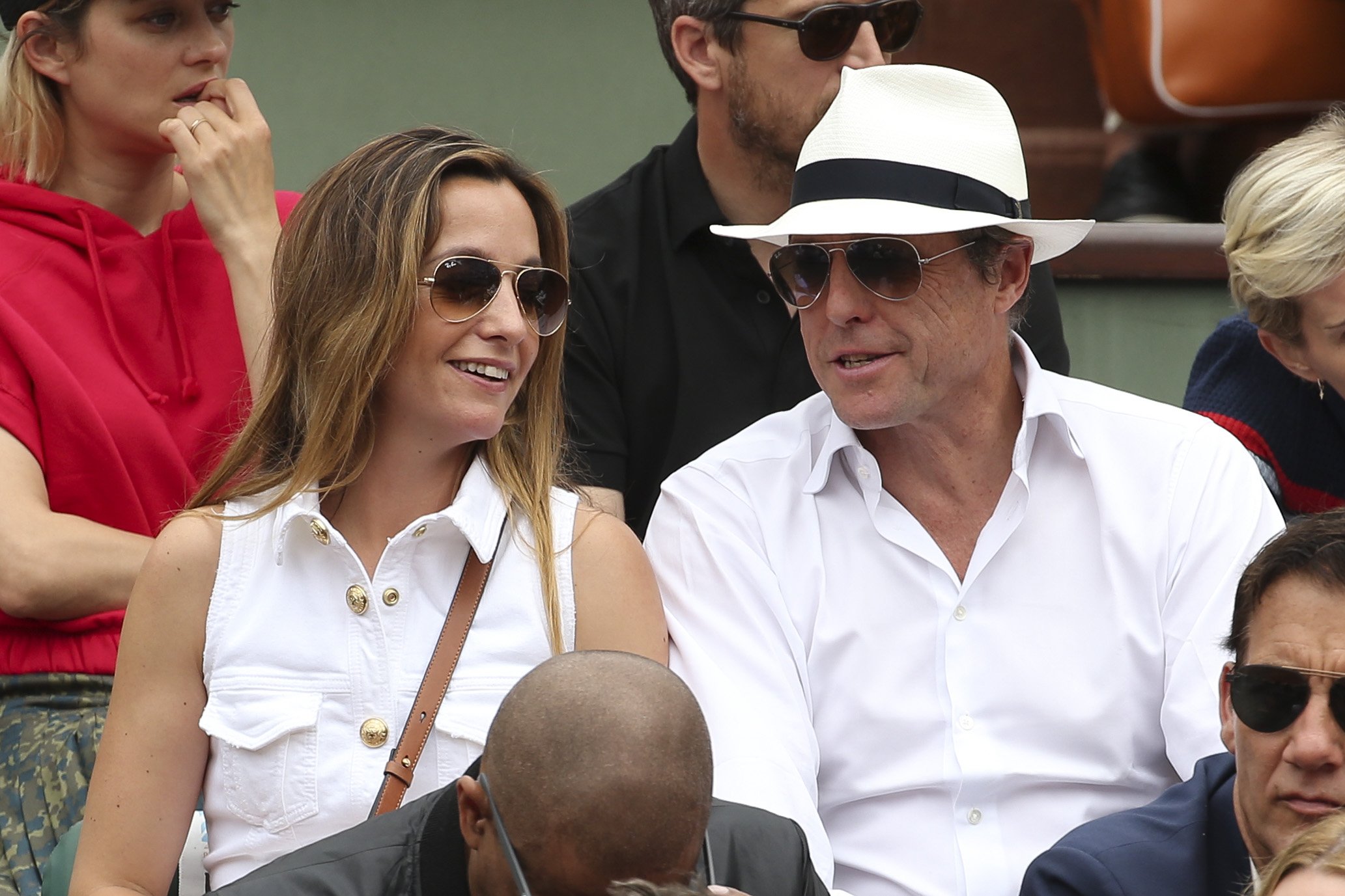 Hugh Grant and his wife Anna Eberstein during the men's final on Day 15 of the 2018 French Open at Roland Garros stadium on June 10, 2018 in Paris, France. | Source: Getty Images 