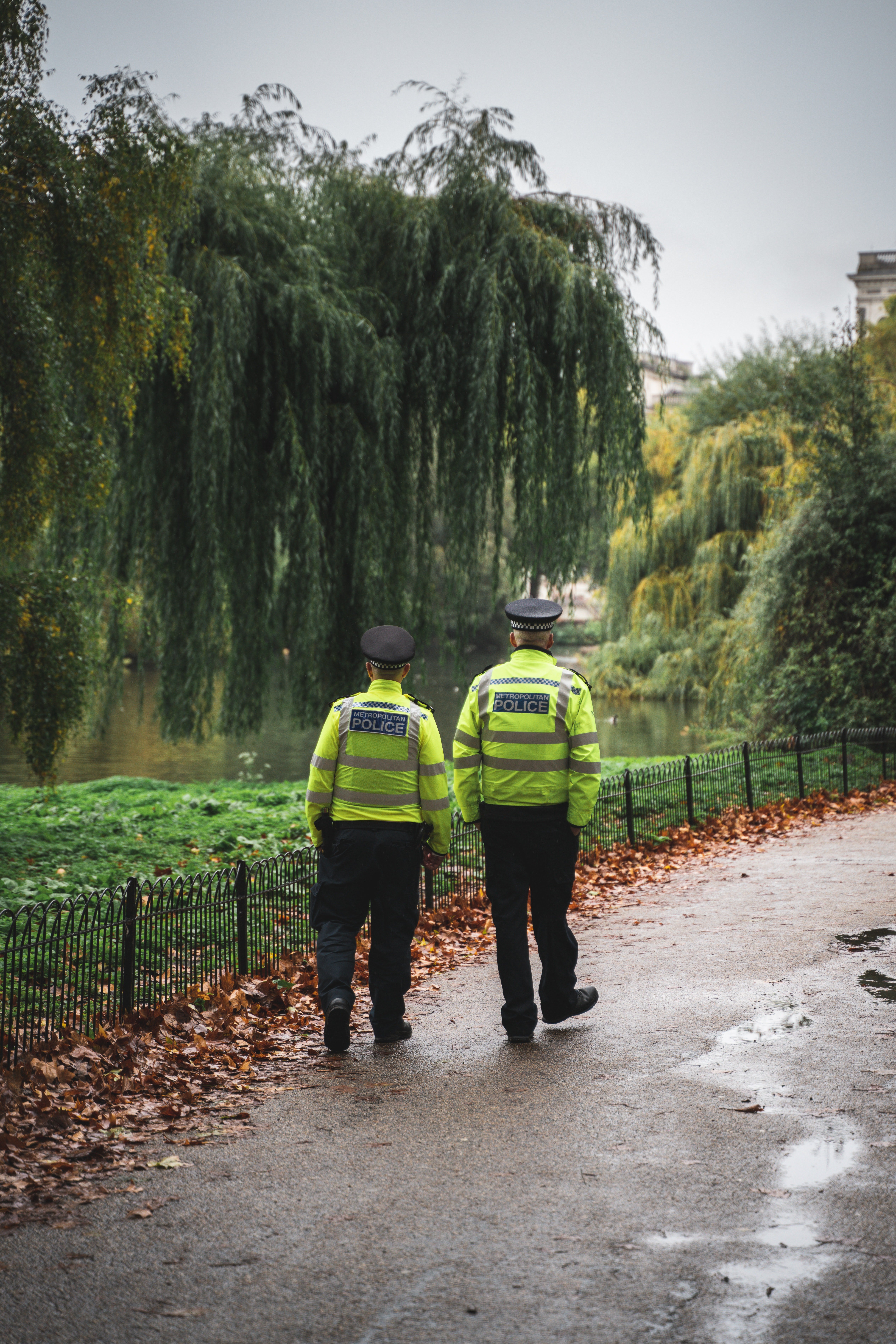 Two police officers walking along a park | Photo: Pexels