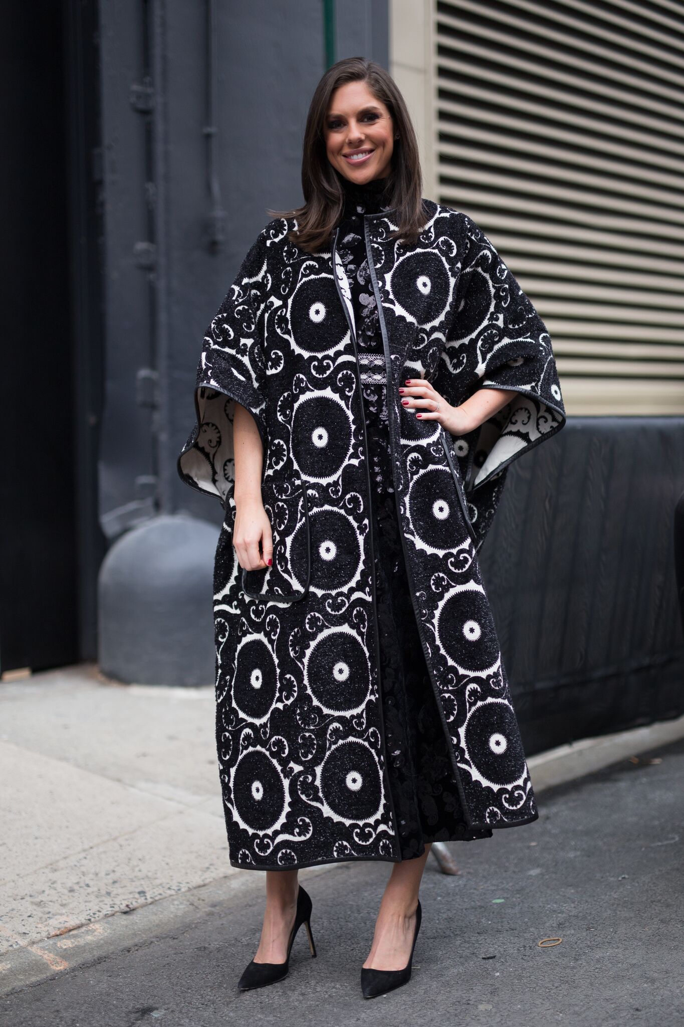 Abby Huntsman is seen attending Vivienne Tam during New York Fashion Week while wearing black and white circle design coat | Getty Images