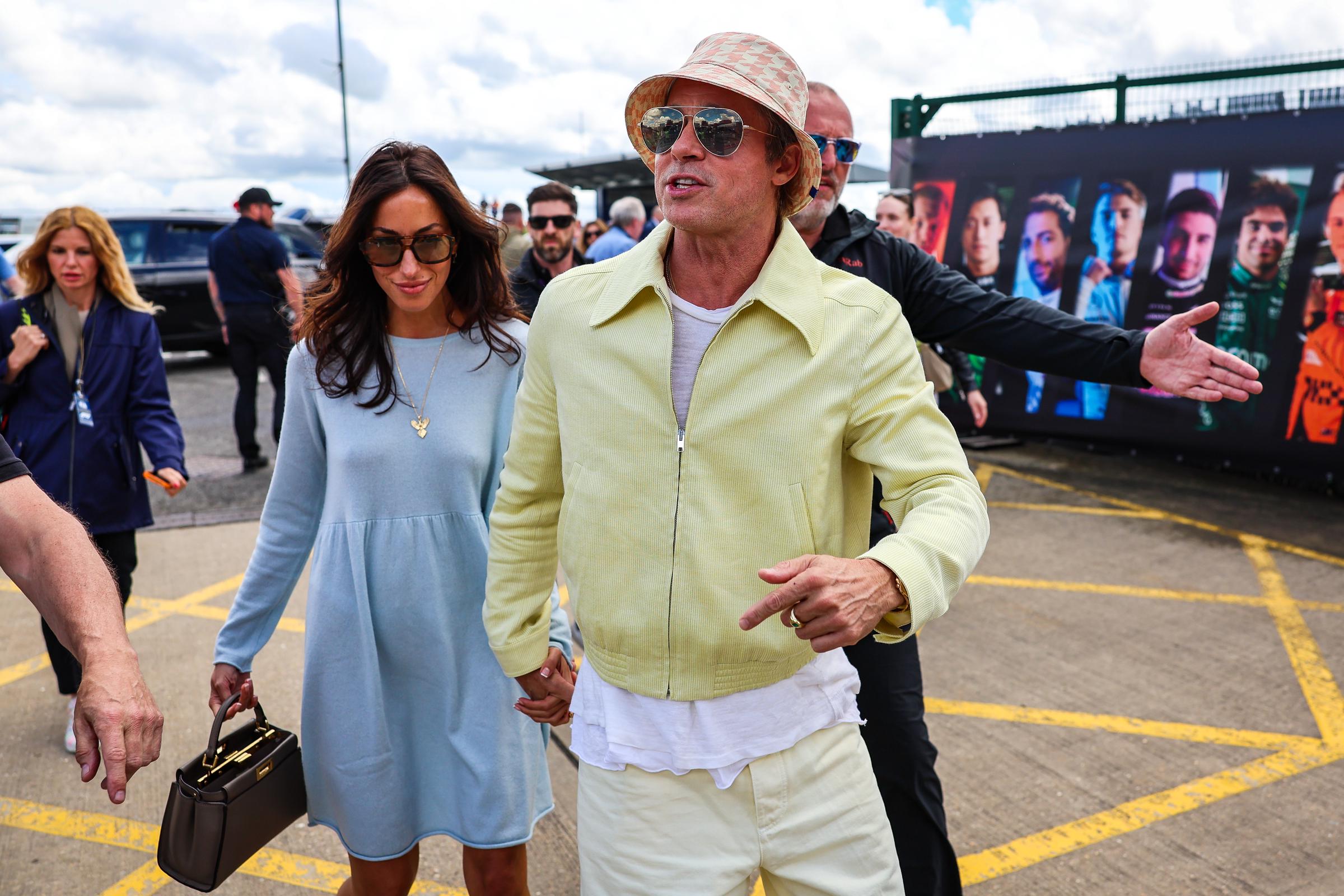 Ines de Ramon and Brad Pitt at the F1 Grand Prix of Great Britain at Silverstone Circuit in Northampton, England on July 7, 2024 | Source: Getty Images