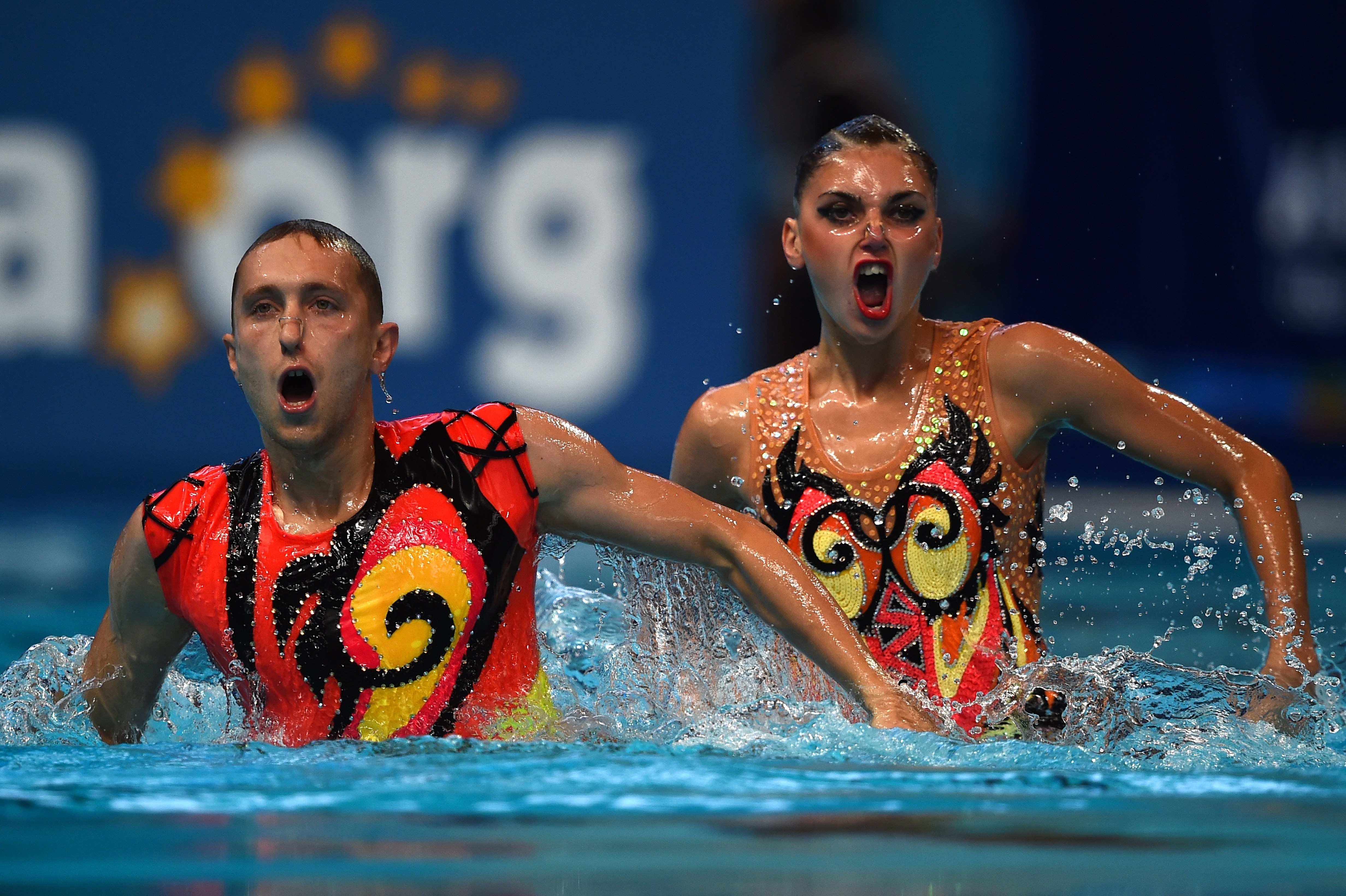 Ukraine's mixed duet Oleksandra Sabada and Anton Timofeyev compete in the Mixed duet Free preliminary event during the synchronized swimming competition at the 2015 FINA World Championships in Kazan, on July 28, 2015. | Source: Getty Images