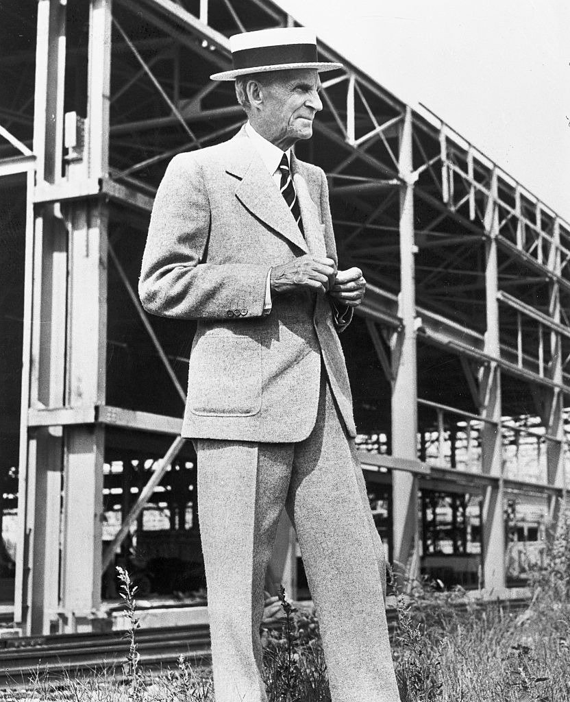 Henry Ford posing in front of scaffolding during the construction of a Ford Motors aircraft factory in Willow Run, Michigan | Photo: Getty Images