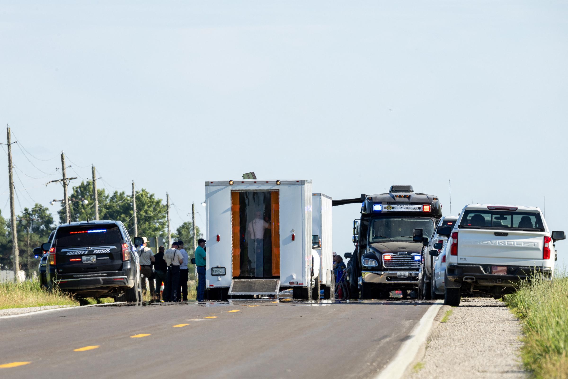 Law enforcement and investigators work near the scene of the fatal skydiving plane crash outside Butler Memorial Airport. Federal authorities are examining reports that the aircraft made a sudden sharp left turn shortly after takeoff before crashing, killing all 12 people on board. | Source: Getty Images