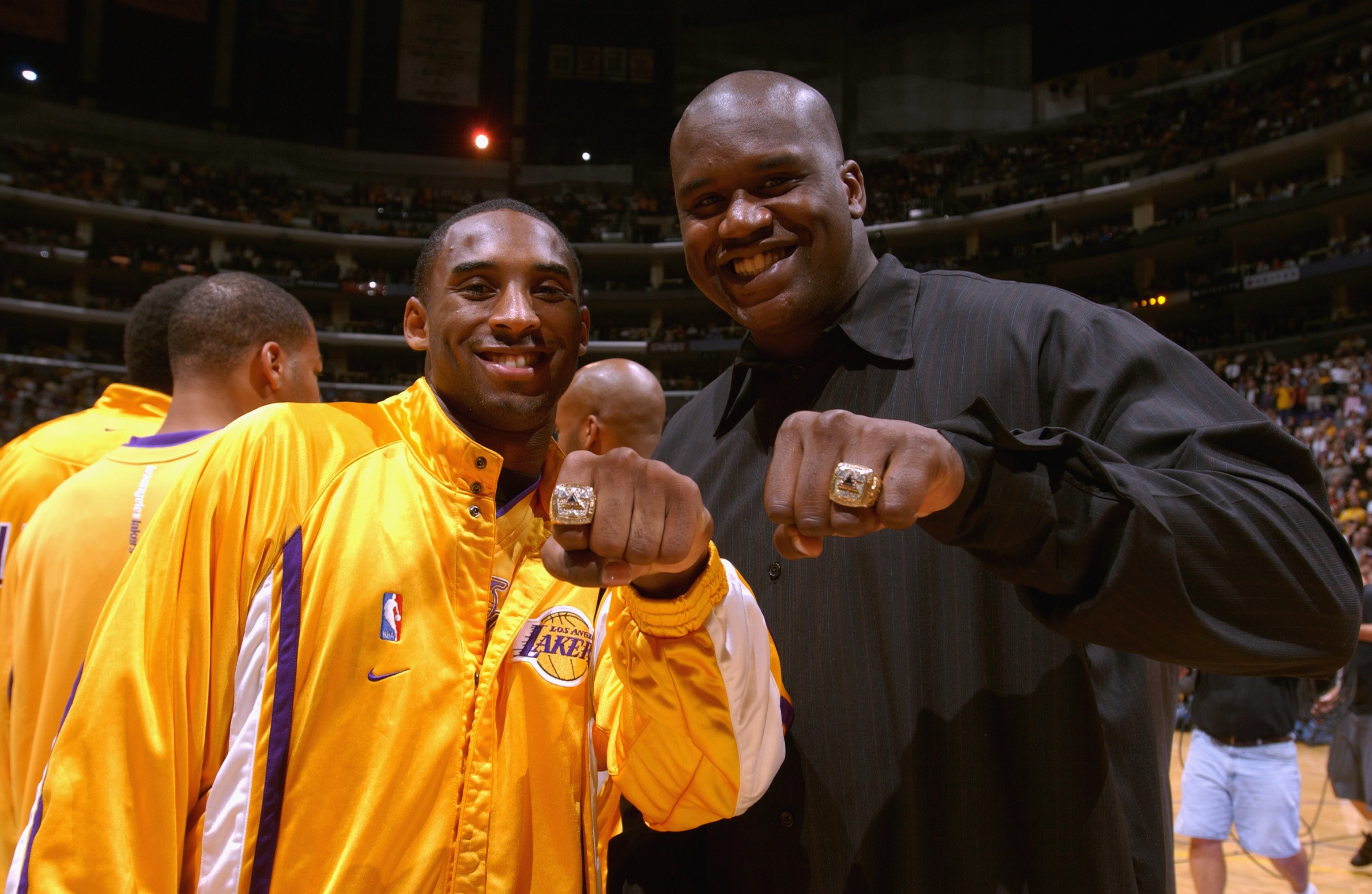 Kobe Bryant and Shaquille O'Neal showing their rings at Staples Center on October 29, 2002 in Los Angeles, California. | Source: Getty Images