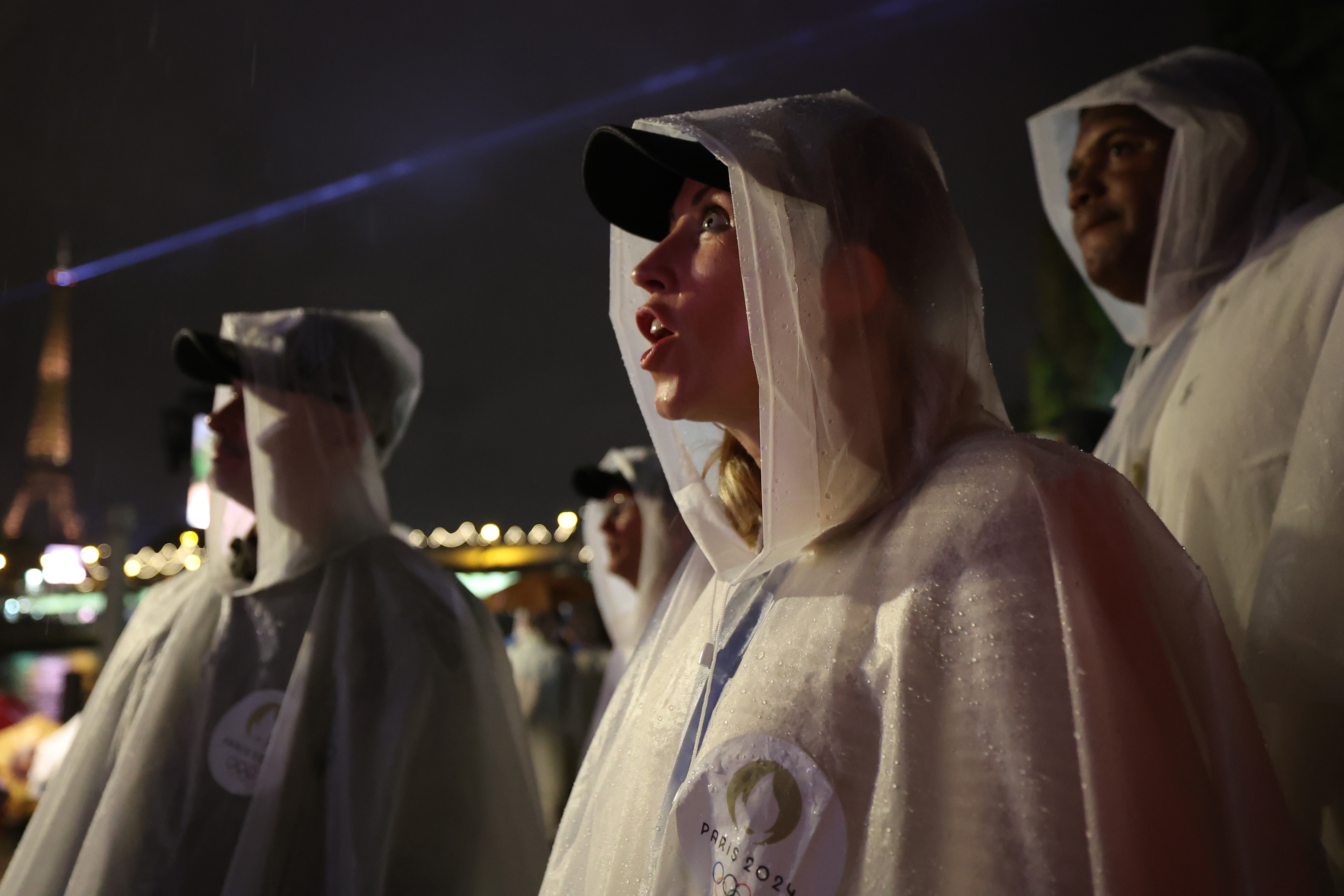 Spectators wearing ponchos to shelter from the rain watch on during the opening ceremony of the Olympic Games Paris 2024 in Paris, France, on July 26, 2024. | Source: Getty Images