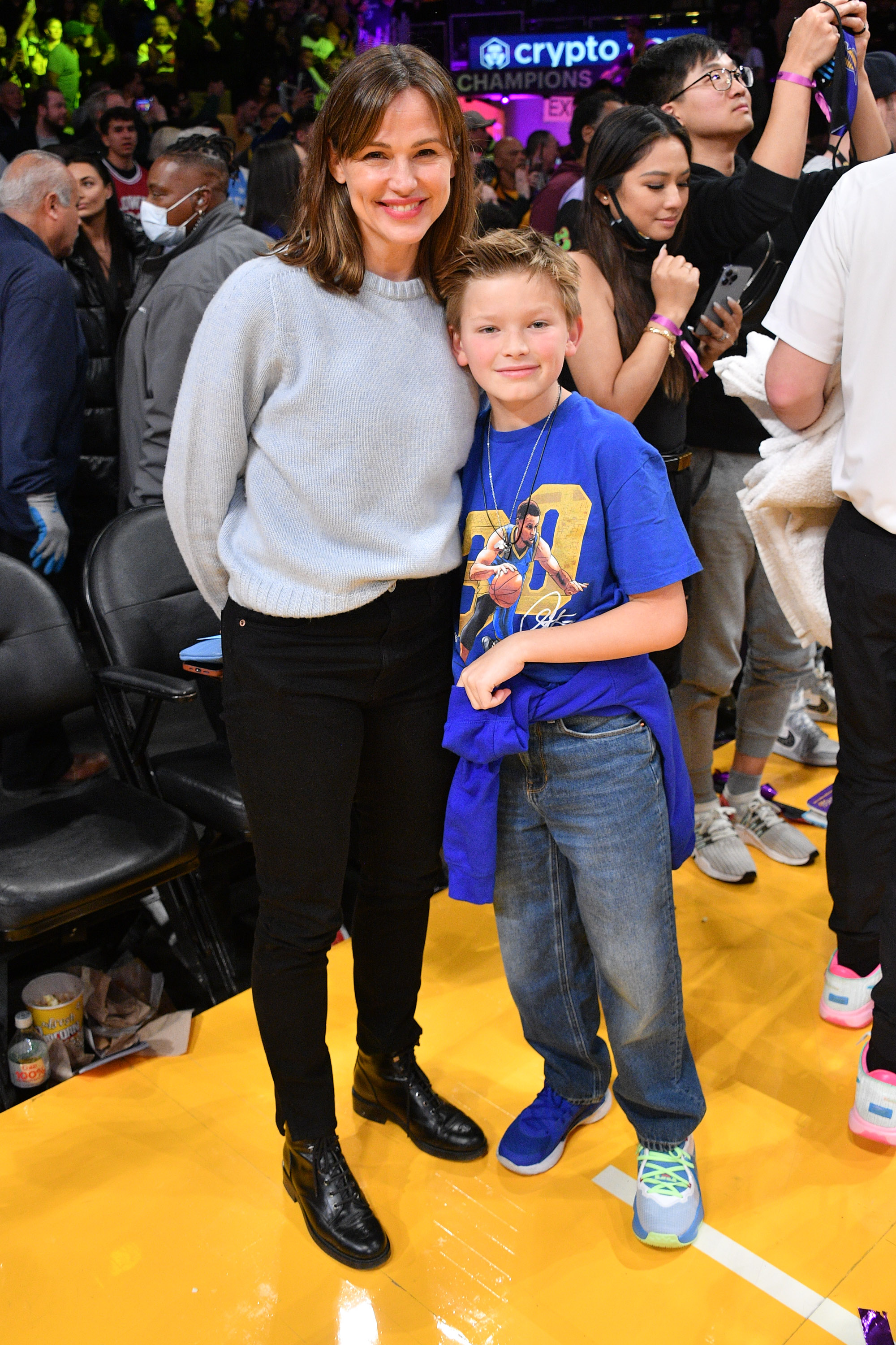 Jennifer Garner and Samuel Garner Affleck smile at the camera at the Crypto.com Arena on March 5, 2023, in Los Angeles, California. | Source: Getty Images