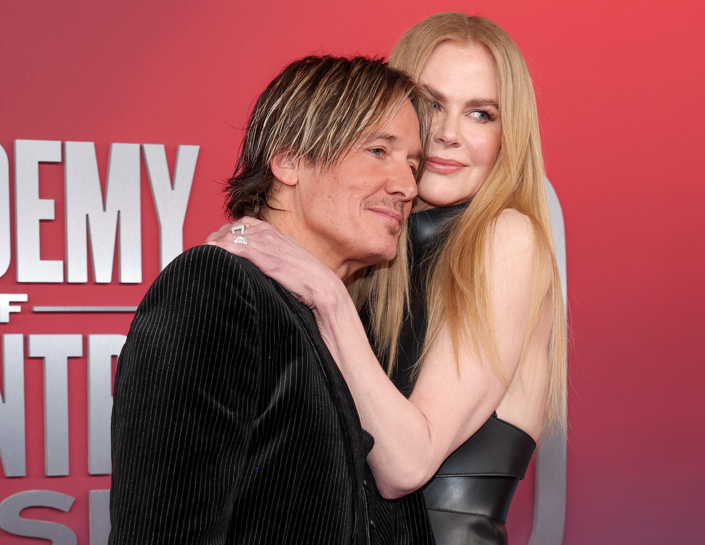 Nicole Kidman and Keith Urban share a close moment at the 60th Academy of Country Music (ACM) Awards in Frisco, Texas, with her arm draped over his shoulder as they press gently together for the camera on country music’s biggest night.