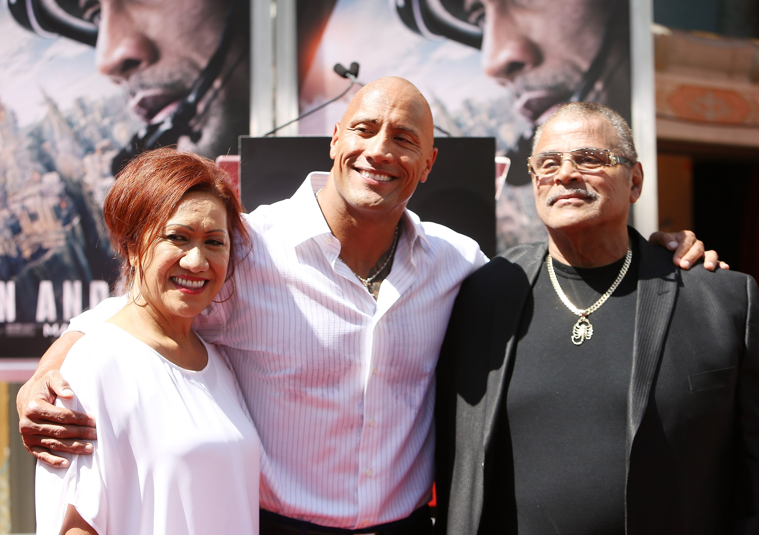 Dwayne "The Rock" Johnson with his parents at the hand/footprint ceremony honoring him at TCL Chinese Theatre IMAX on May 19, 2015, in Hollywood, California | Source: Getty Images