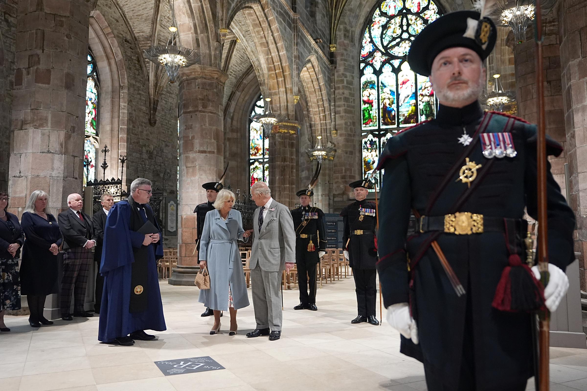 King Charles III and Queen Camilla unveil a memorial stone for Queen Elizabeth II in St Giles Cathedral in Edinburgh, as part of their trip to Scotland for Holyrood Week in Scotland on July 2, 2025 | Source: Getty Images