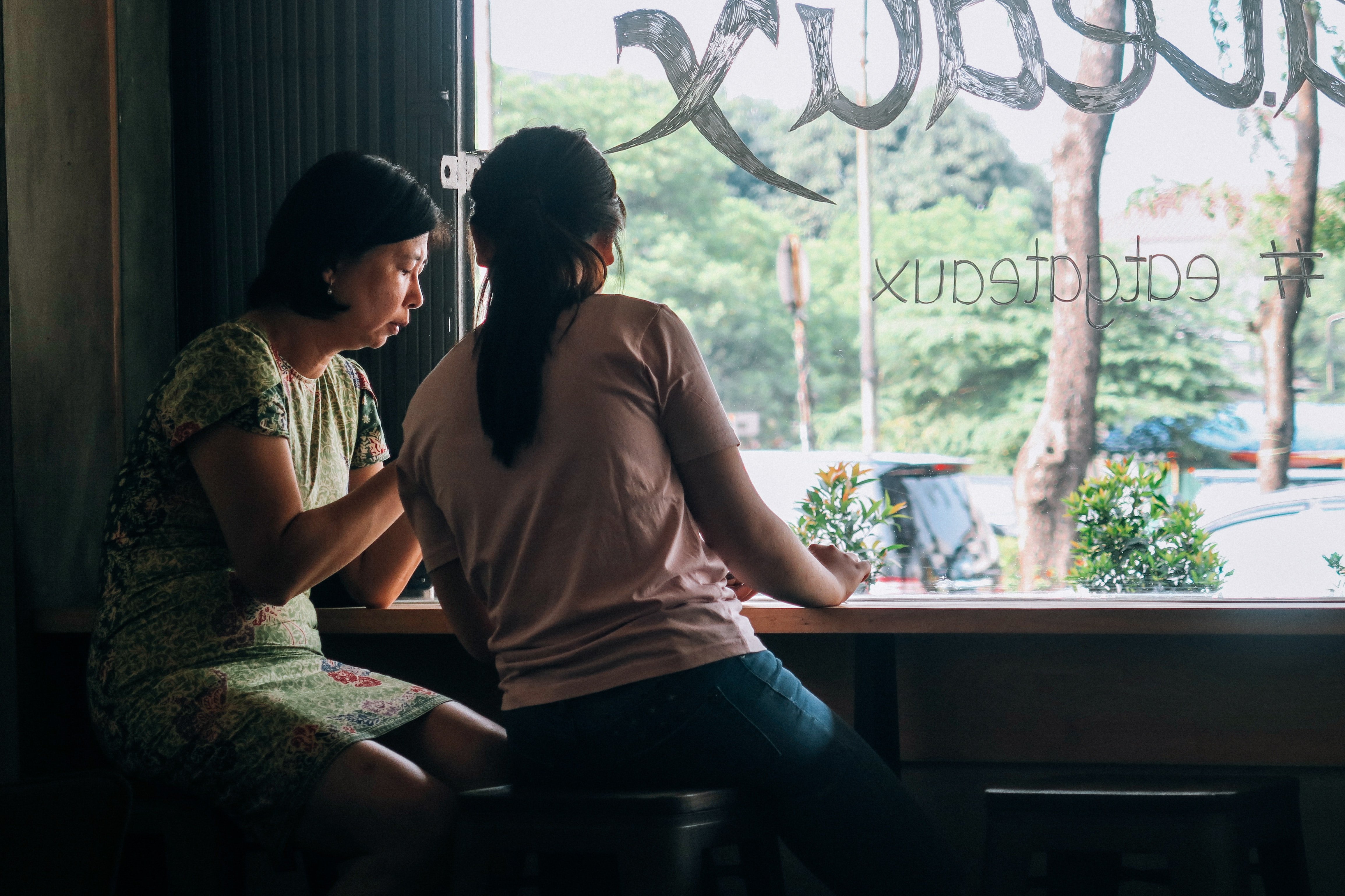An elderly mother and her daughter talking to each other| Photo by Farrel Nobel on Unsplash