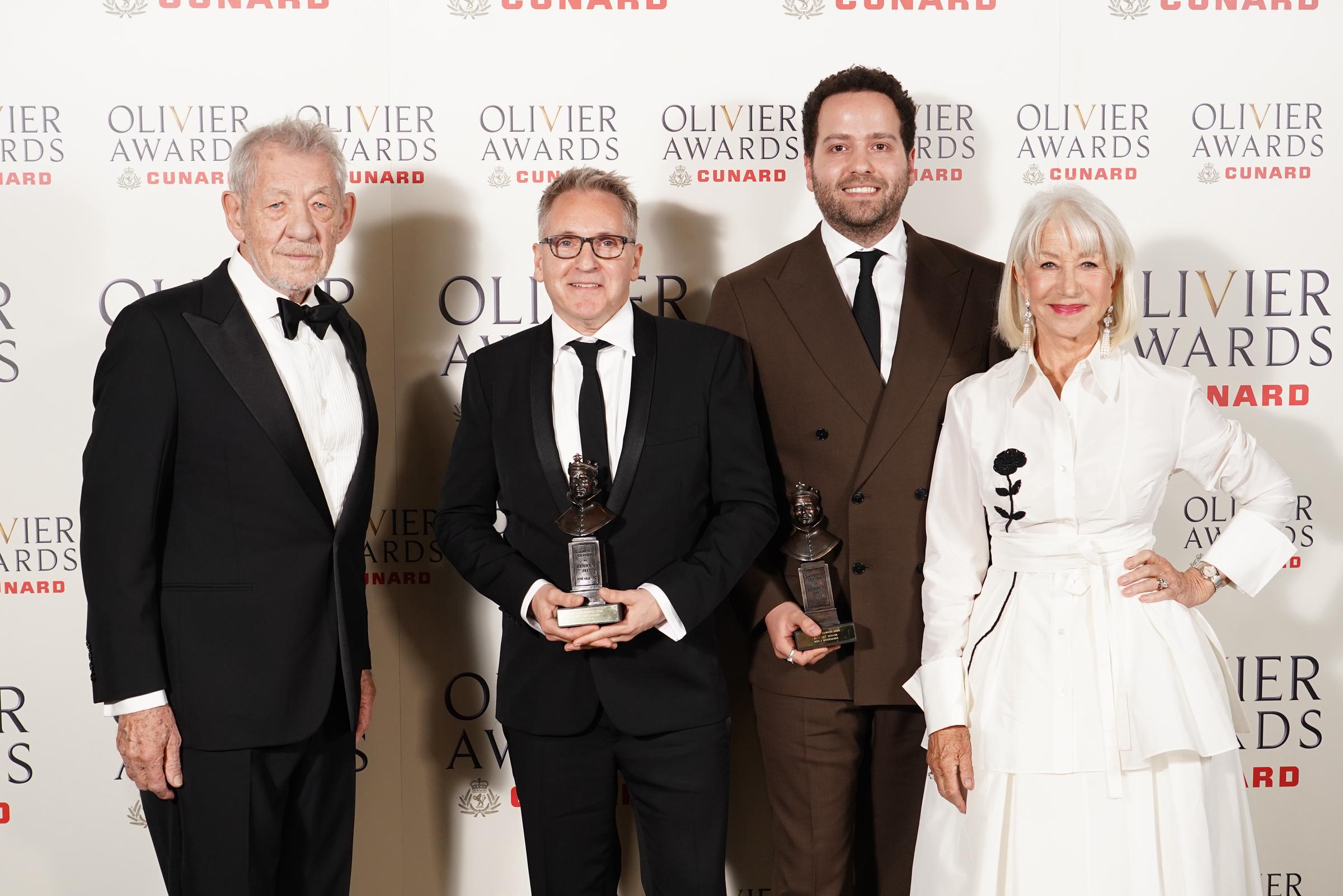 Sir Ian McKellen, Tom Pye, Ash J. Woodward, and Dame Helen Mirren pose inside the Winners Room during The Olivier Awards 2026 on 12 April in London, England. | Source: Getty Images