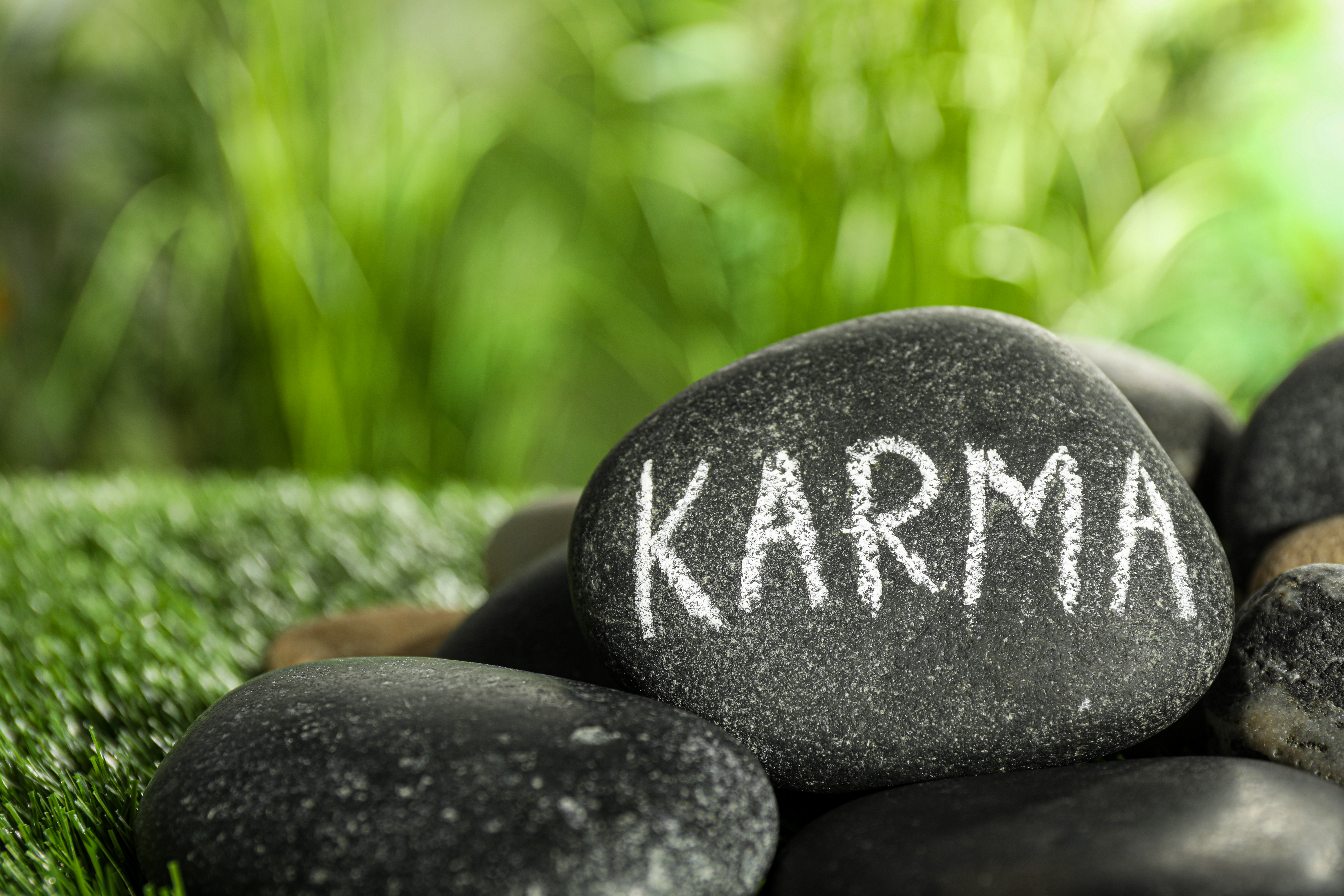 Karma written on a stone | Source: Getty Images