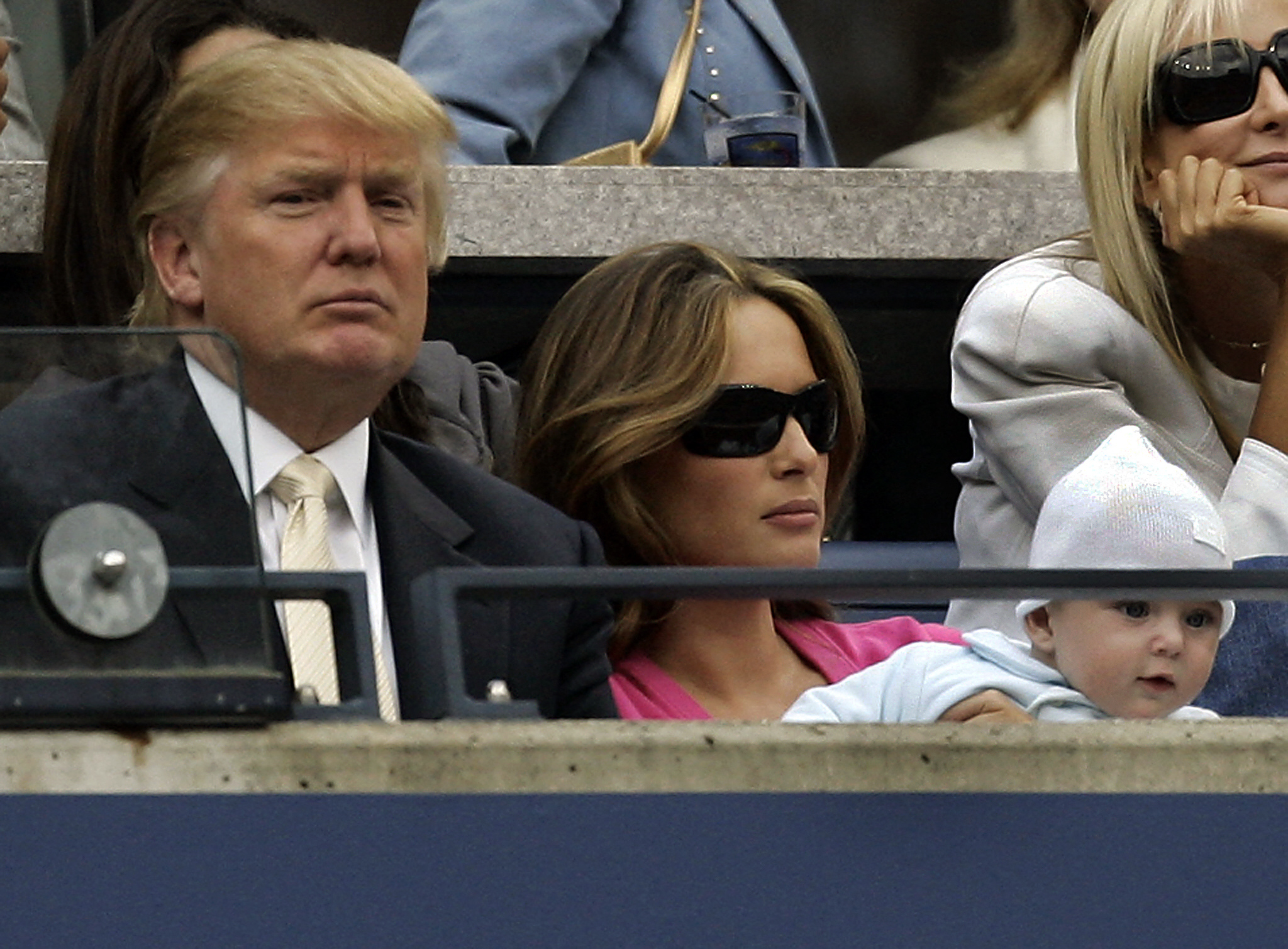 Donald, Melania, and baby Barron Trump attend the 2006 US Open men's final between Roger Federer and Andy Roddick at the USTA National Tennis Center in Flushing Meadows, New York, on September 10, 2006. | Source: Getty Images