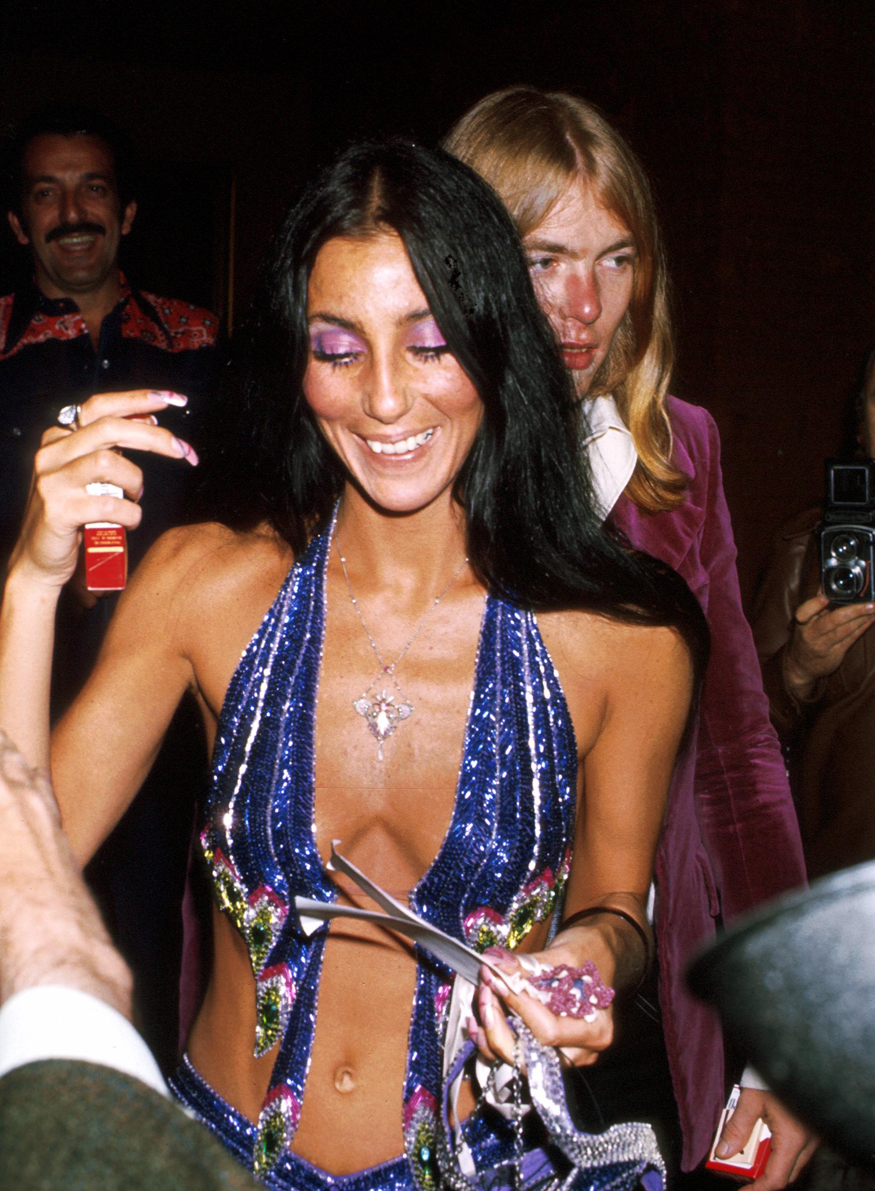 Cher and Gregg Allman attend an event in 1977. | Source: Getty Images