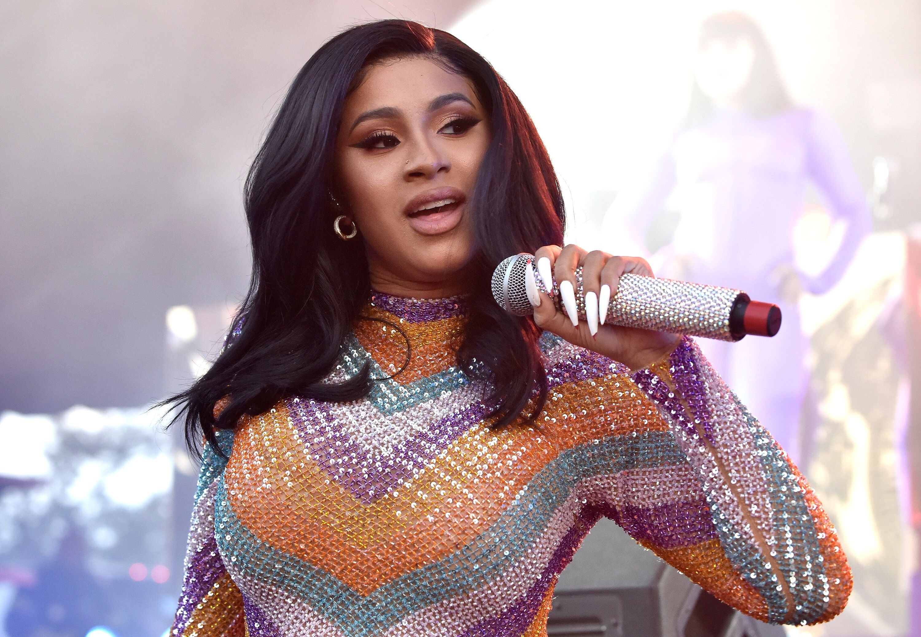 Cardi B performing onstage in a colorful ensemble | Source: Getty Images/GlobalImagesUkraine