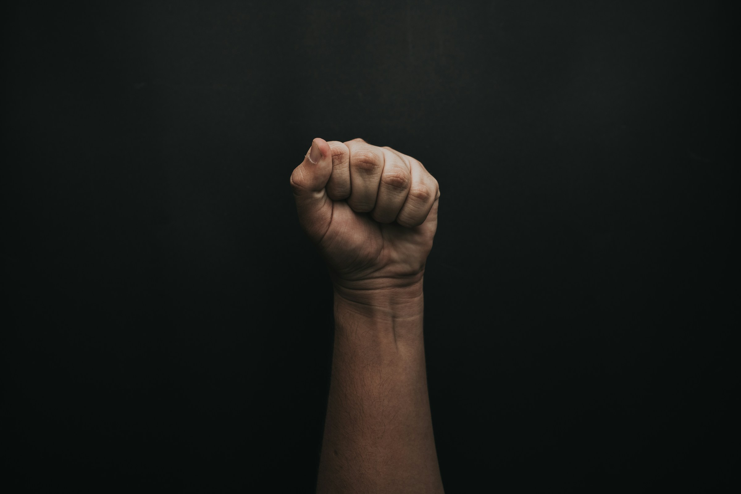 A person's clenched fist | Source: Unsplash