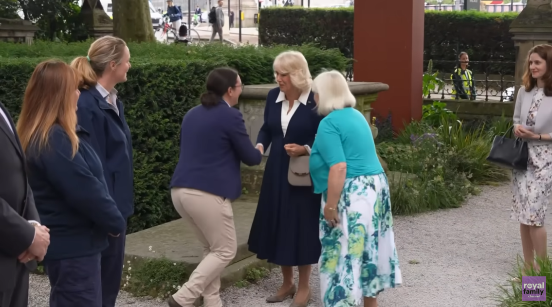 Queen Camilla arrives and exchanges gestures with the staff at the Garden Museum, June 2024. | Source: YouTube
