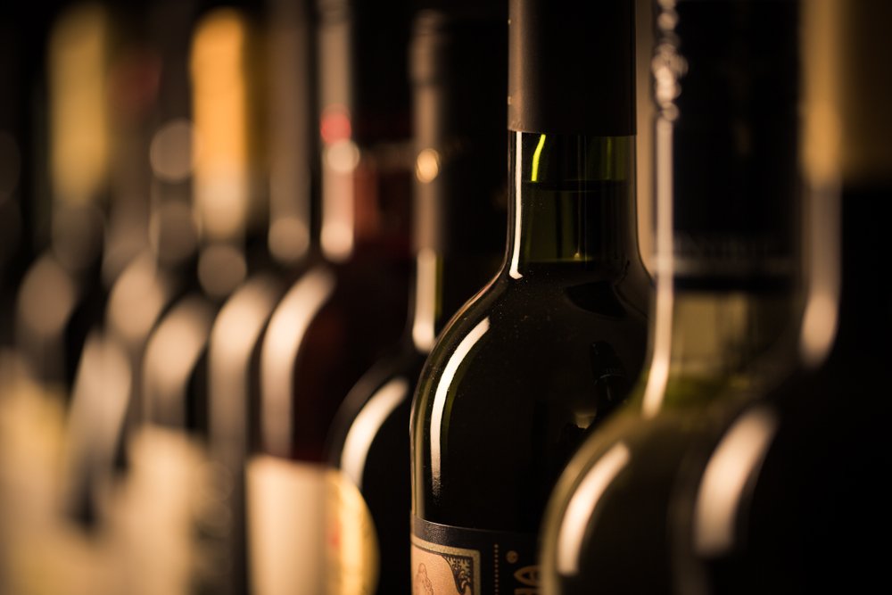 A photo of a row of wine bottles | Photo: Shutterstock