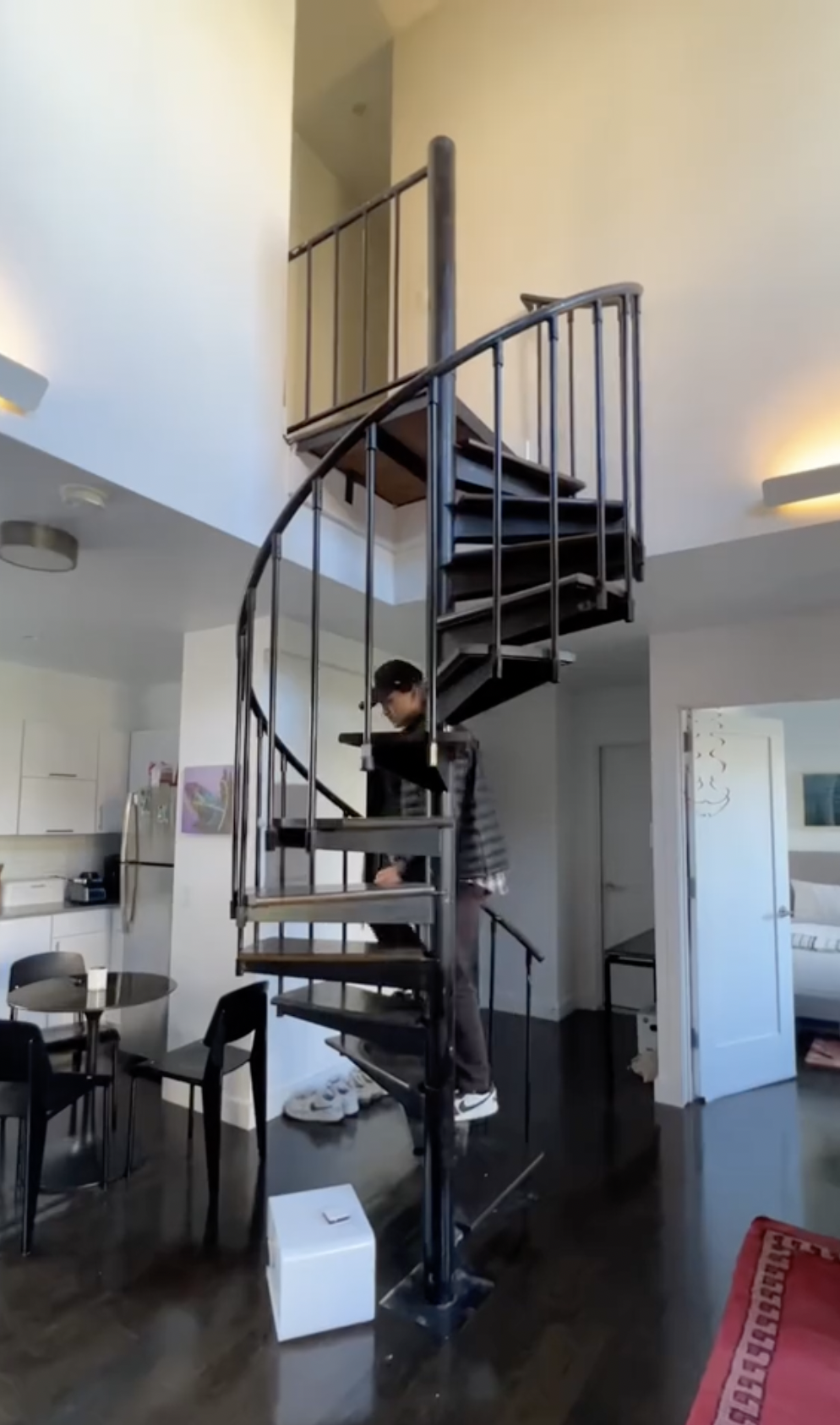 A photo of Deacon Phillippe walking up his spiral staircase inside his apartment in West Village, New York posted on November 15, 2023 | Source: TikTok/calebwsimpson