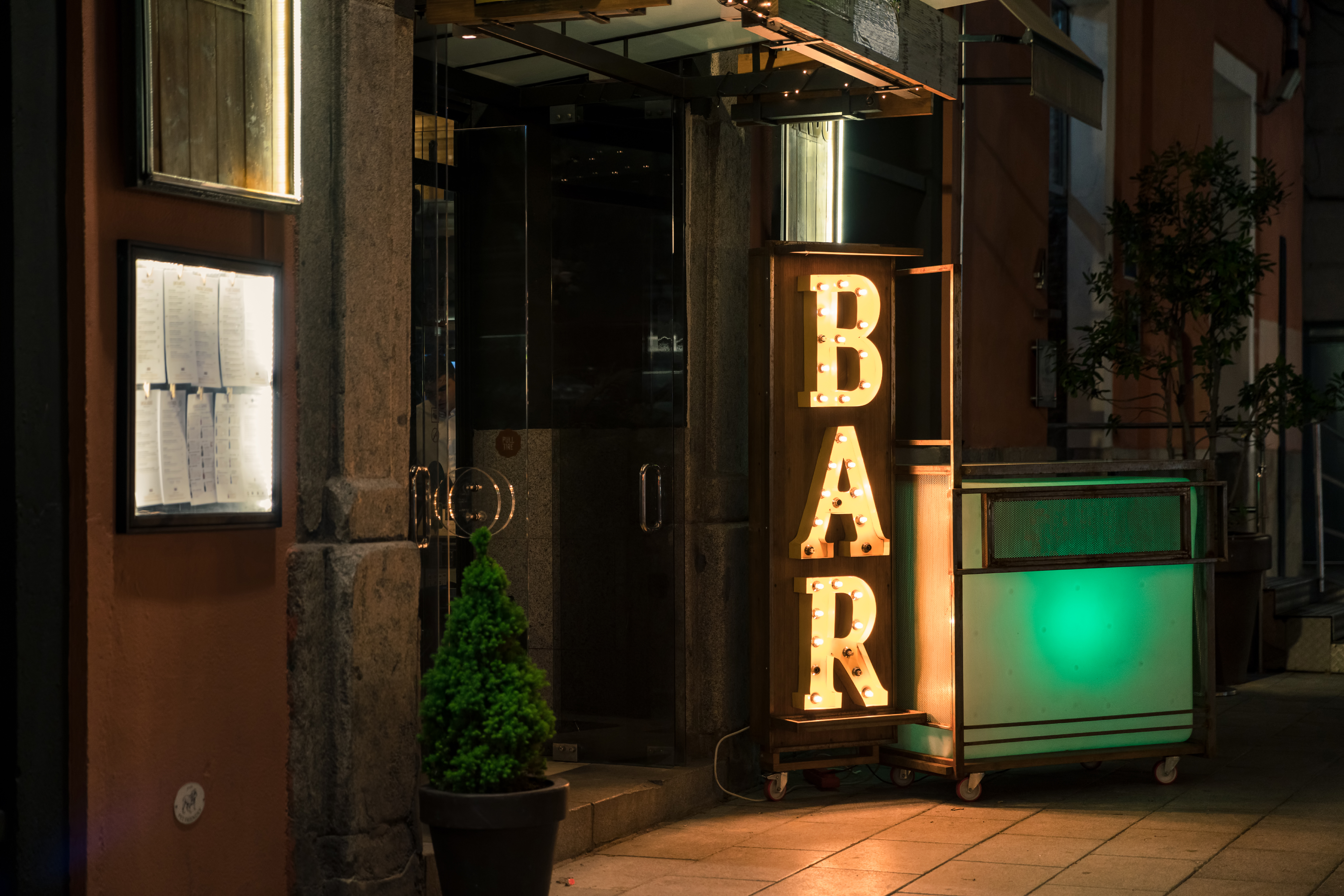Bar Electric Light Sign From Outside. | Source: Shutterstock