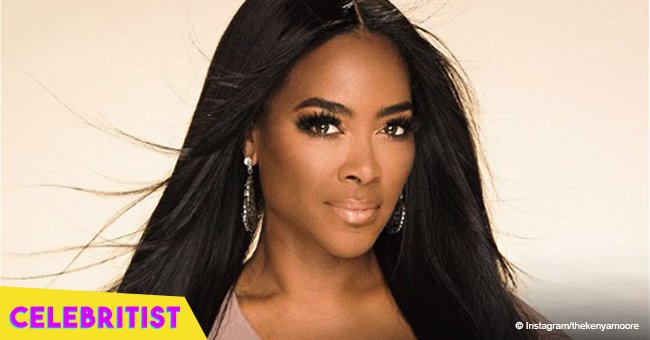 Kenya Moore shares photo with dad holding a cigar after not inviting him to her wedding