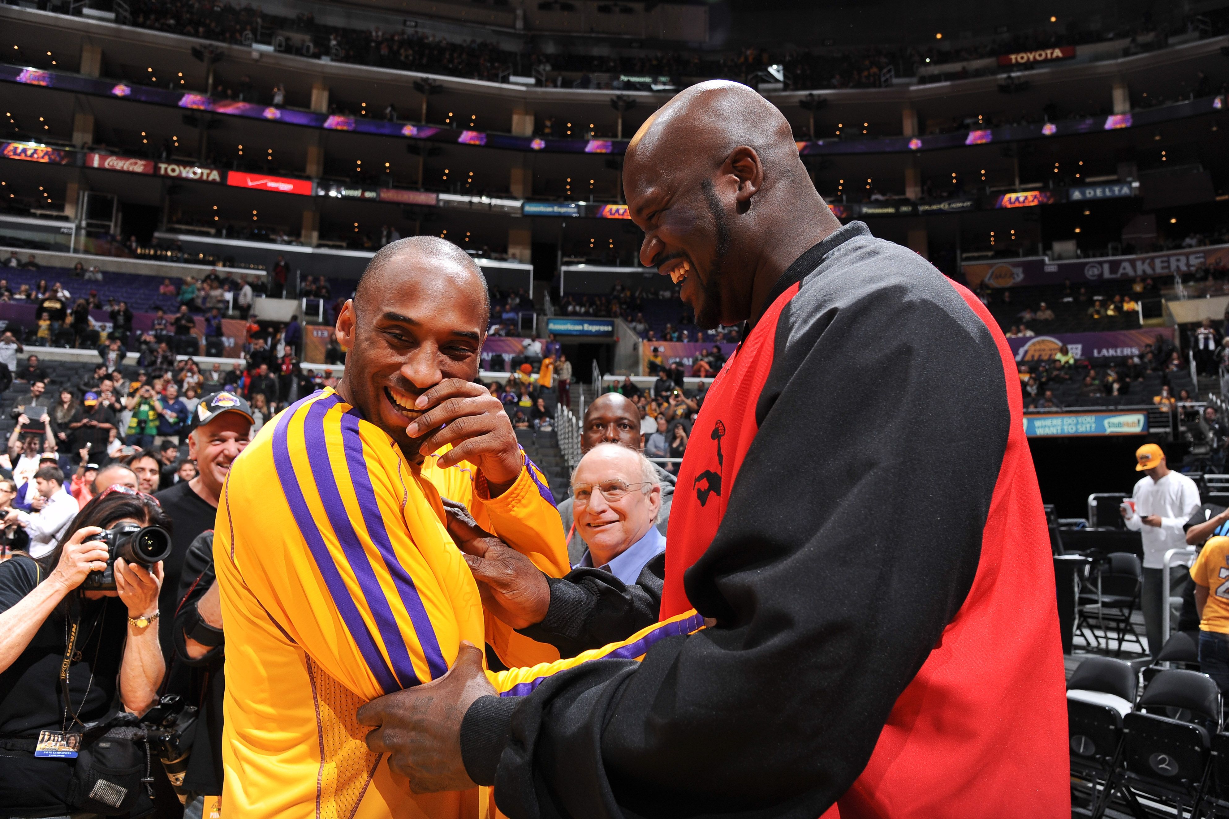 Shaquille O'Neal with former teammate Kobe Bryant #24 of the Los Angeles Lakers at Staples Center in February 2013 in Los Angeles, California | Source: Getty Images
