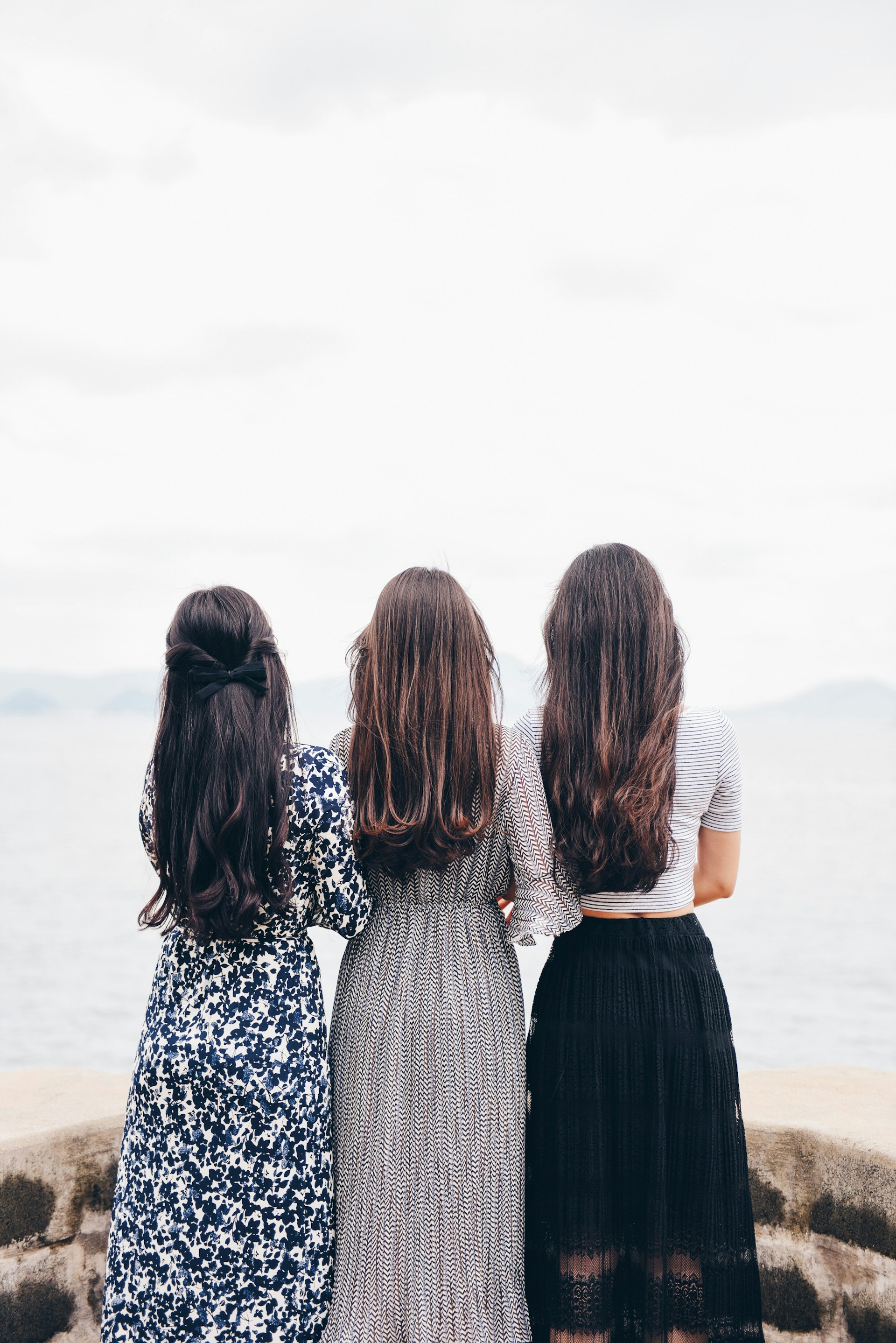 Three women standing together | Source: Unsplash