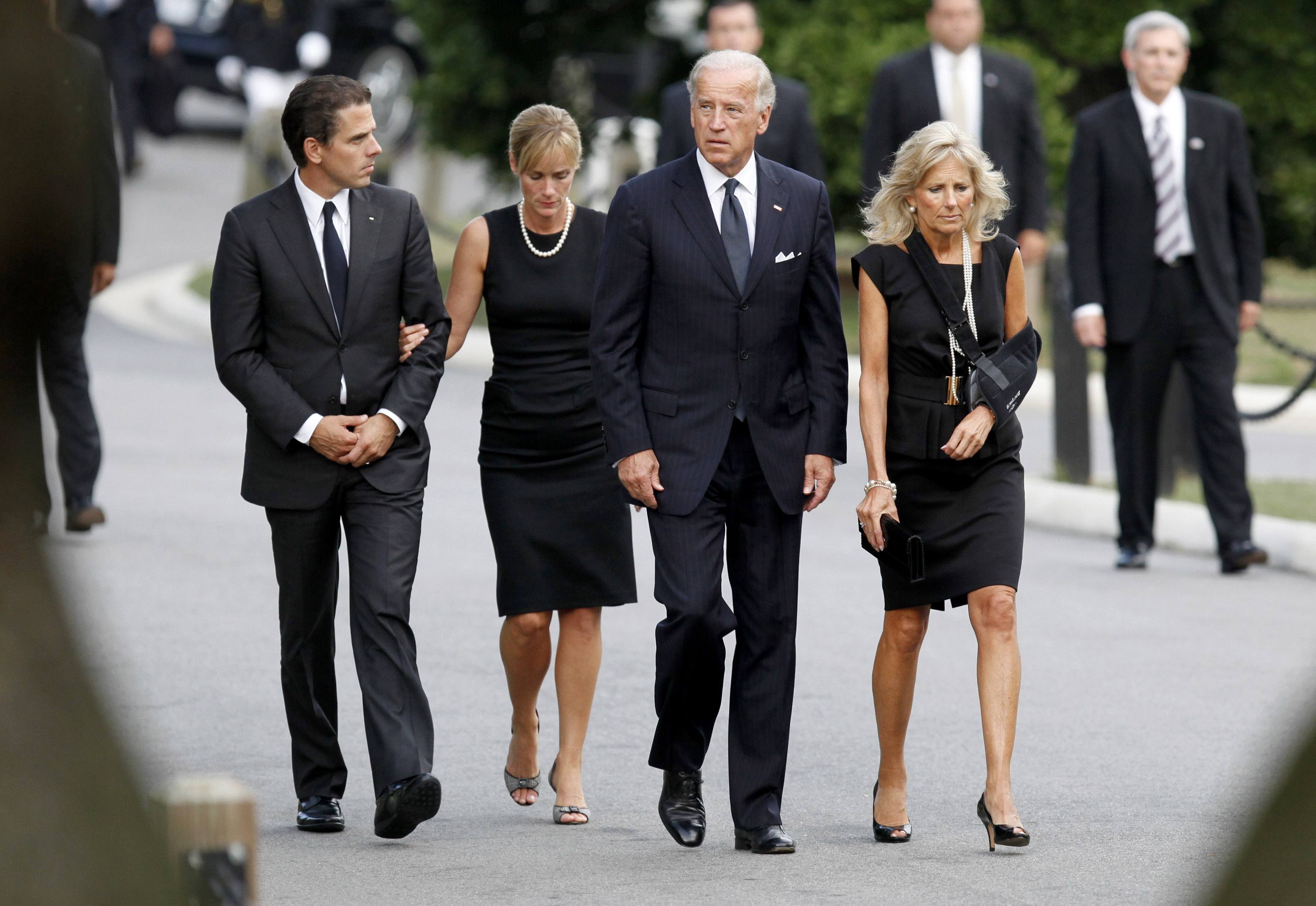 Joe Biden walks with his wife Jill Biden, son Hunter Biden, and daughter-in-law Kathleen Biden at Arlington National Cemetery for the burial of U.S. Senator Edward Kennedy, on August 29, 2009, in Arlington, Virginia. | Source: Getty Images