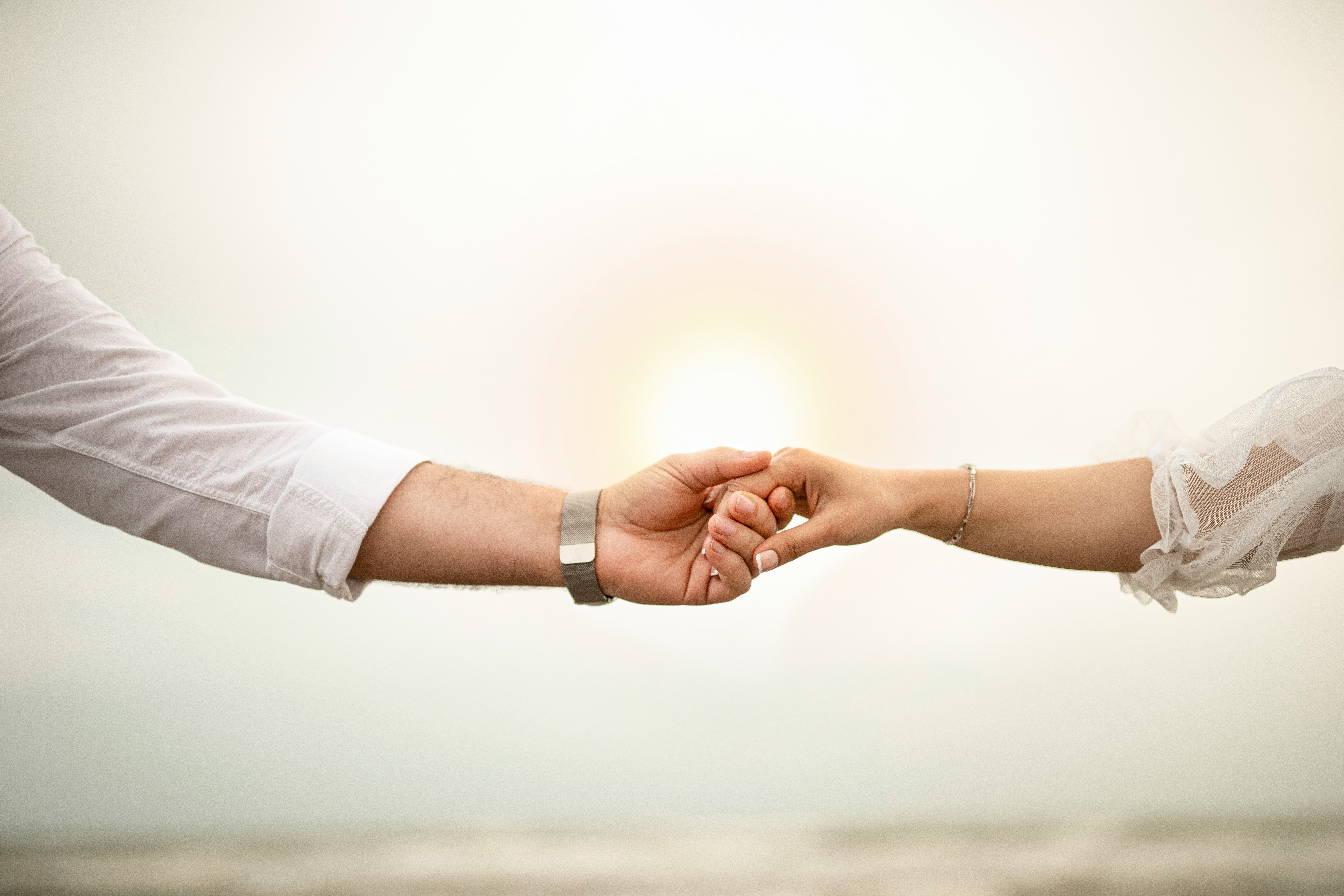 A man and woman's hands touching to seal a deal | Source: Unsplash