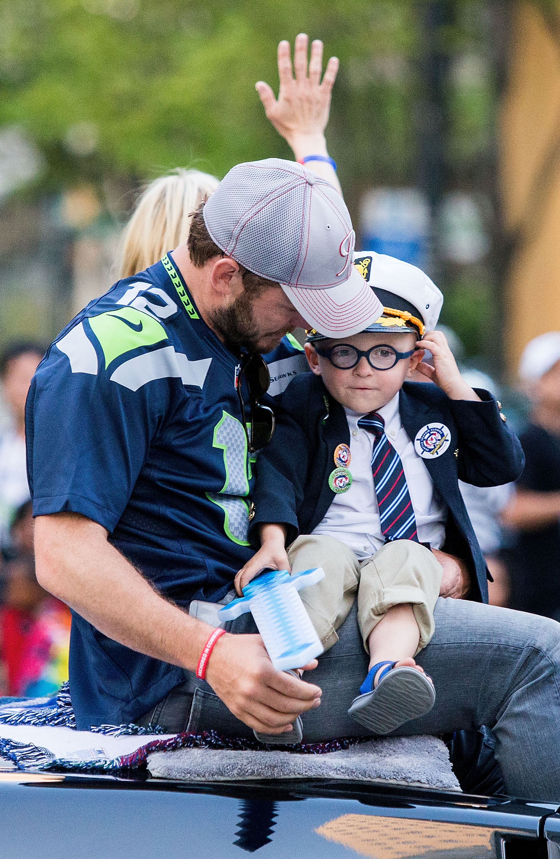 Chris Pratt shares a sweet father-son moment with Jack Pratt while participating in the Seafair Torchlight Parade. The pair rode through the event together, with Jack clutching a toy sword and embracing his role as one of the parade's most adorable participants.