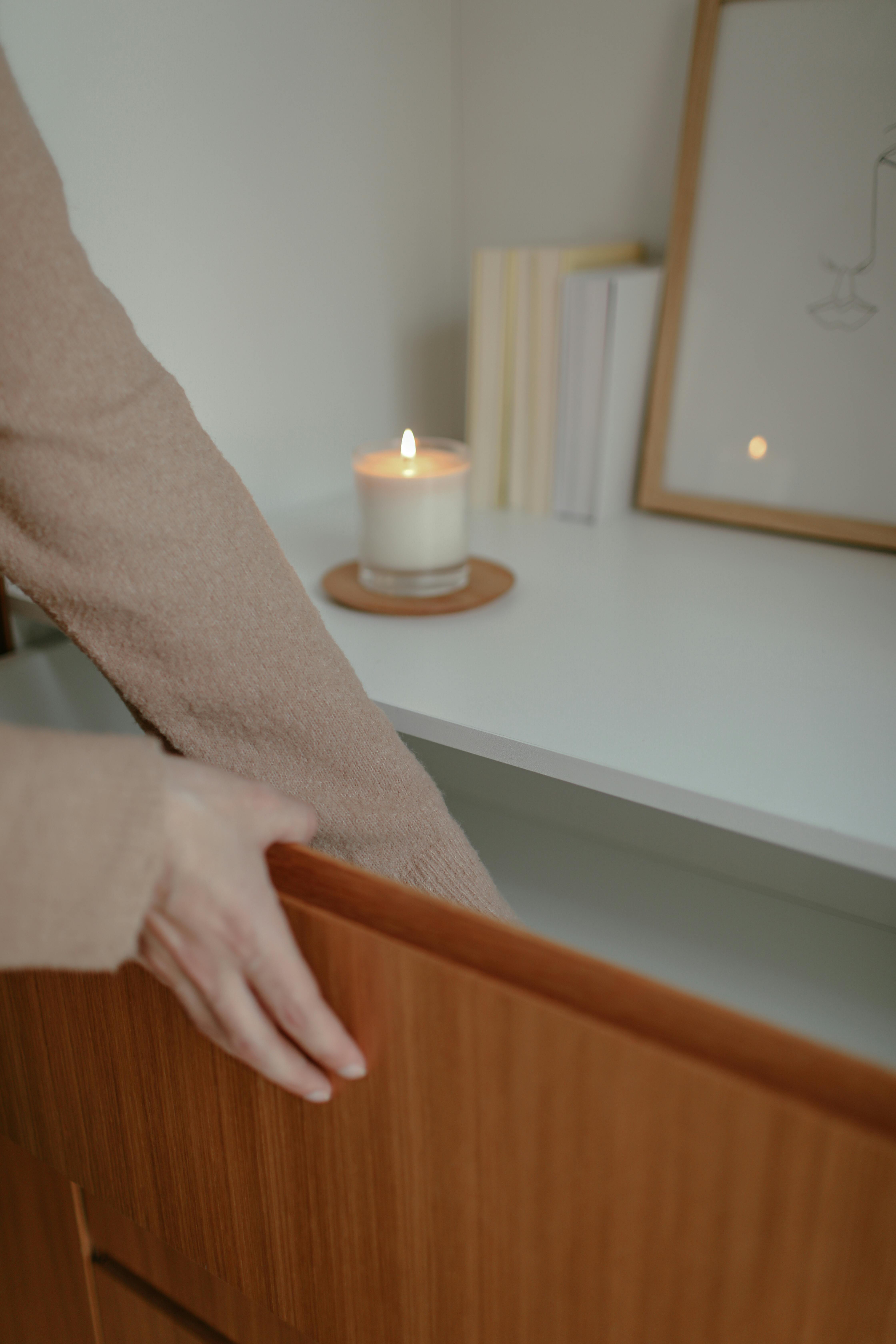 A woman reaching into a drawer | Source: Pexels