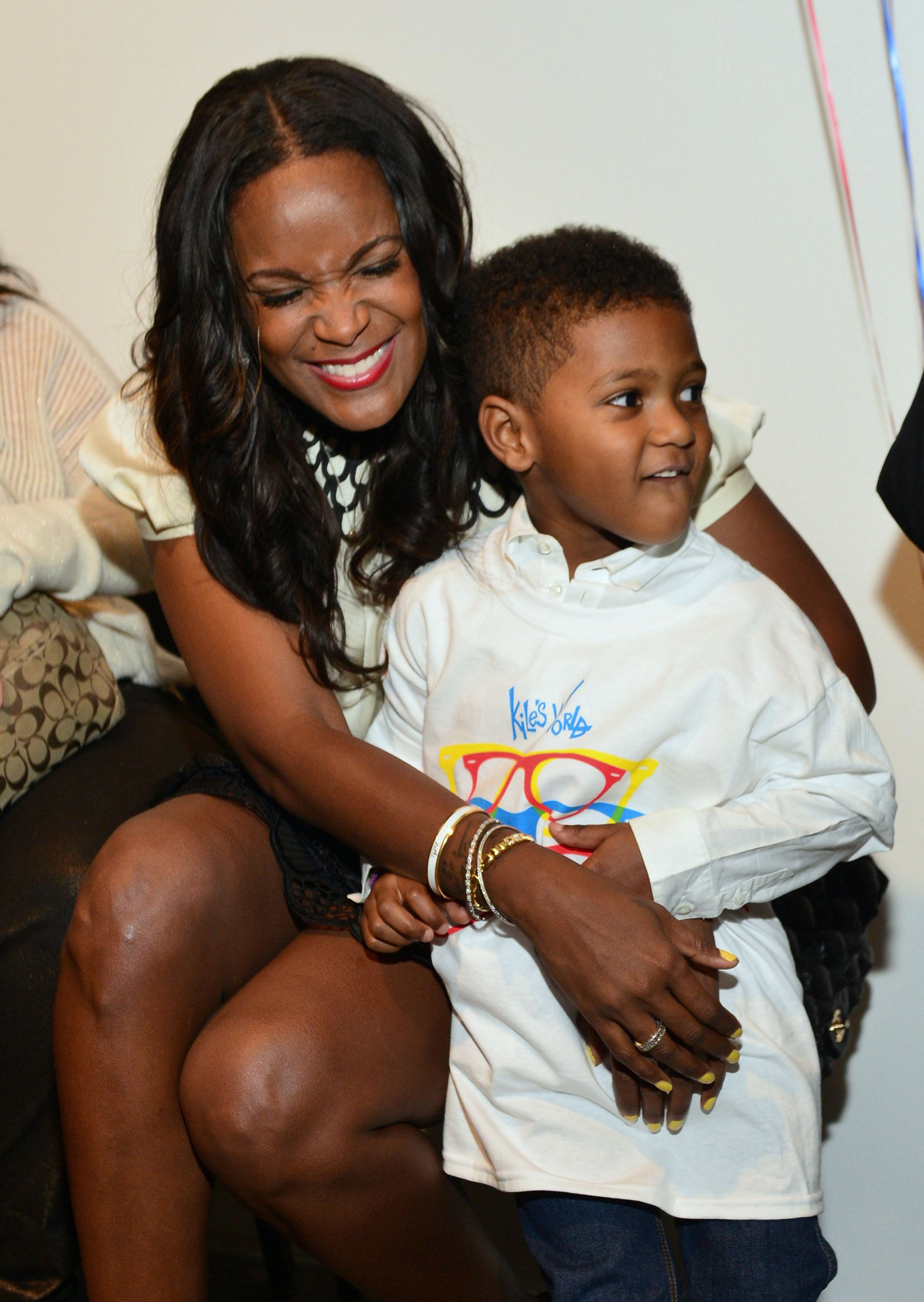 Tameka Foster and Naviyd Raymond during the birthday and foundation lanuch Kile's World to honor Kile Glover at the Woodruff Arts Center on March 29, 2013 in Atlanta, Georgia. | Source: Getty Images