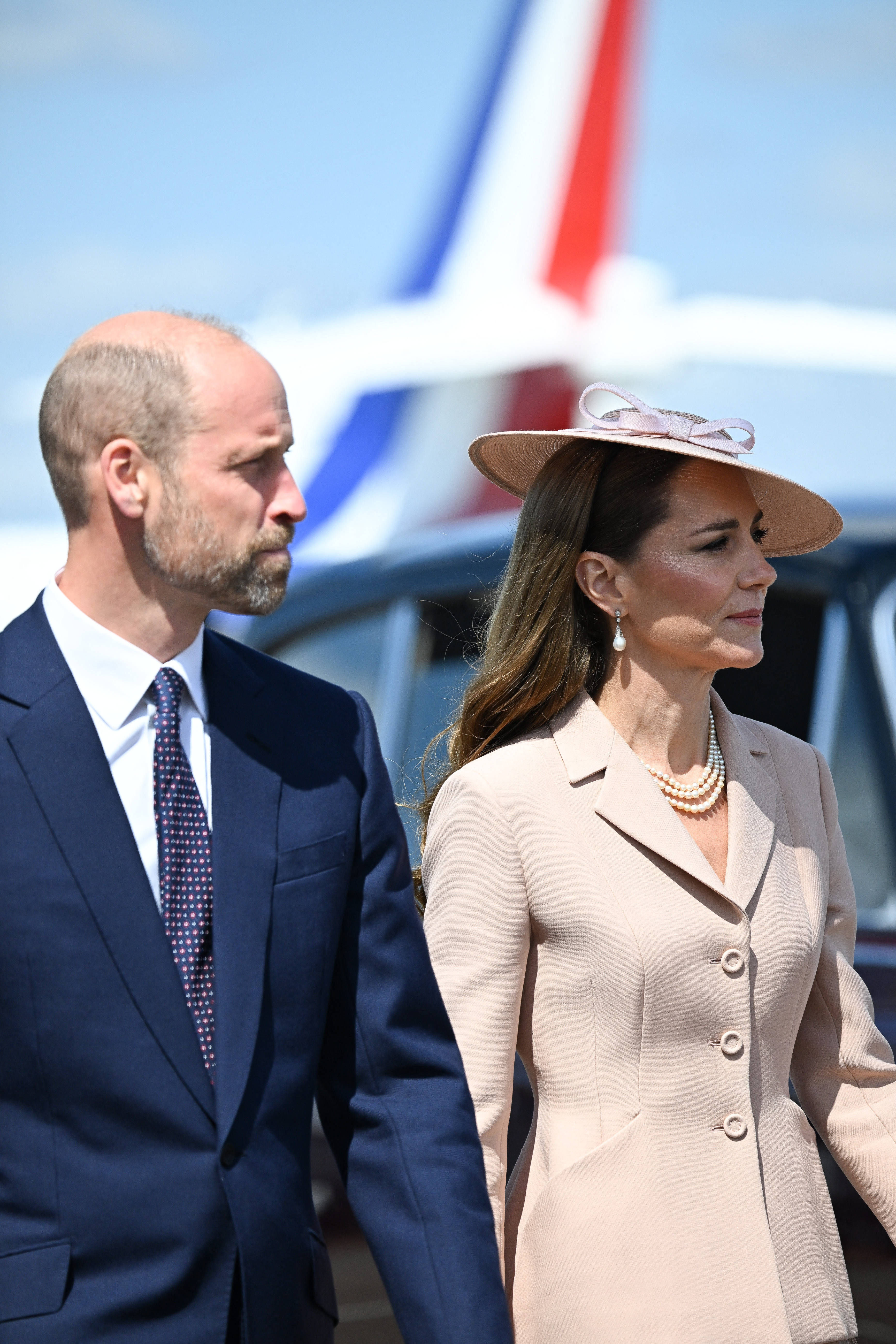 Prince William and Princess Catherine stand alongside each other as they awaited the arrival of the French delegation at RAF Northolt.