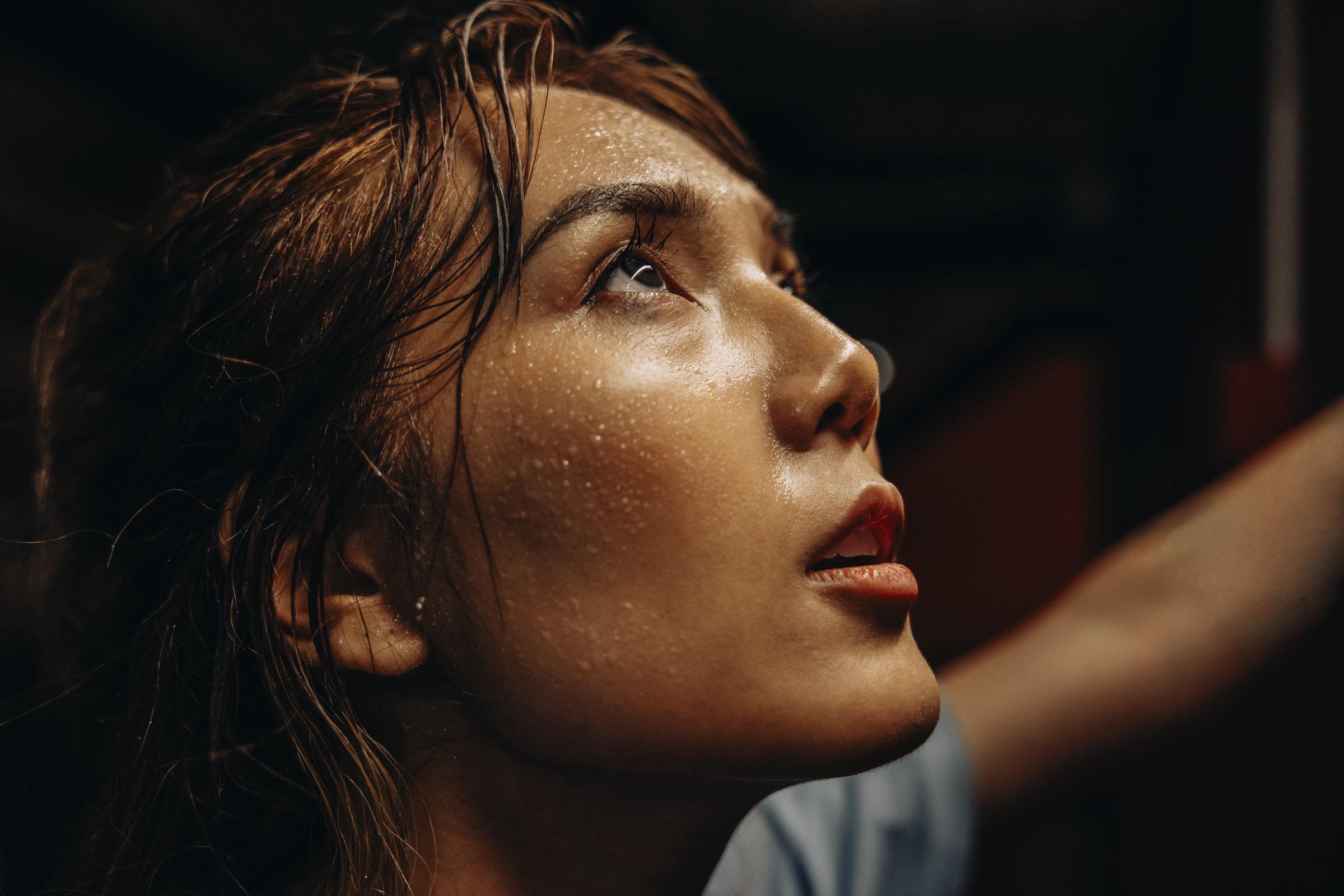 A woman sweating during a workout | Source: Getty Images