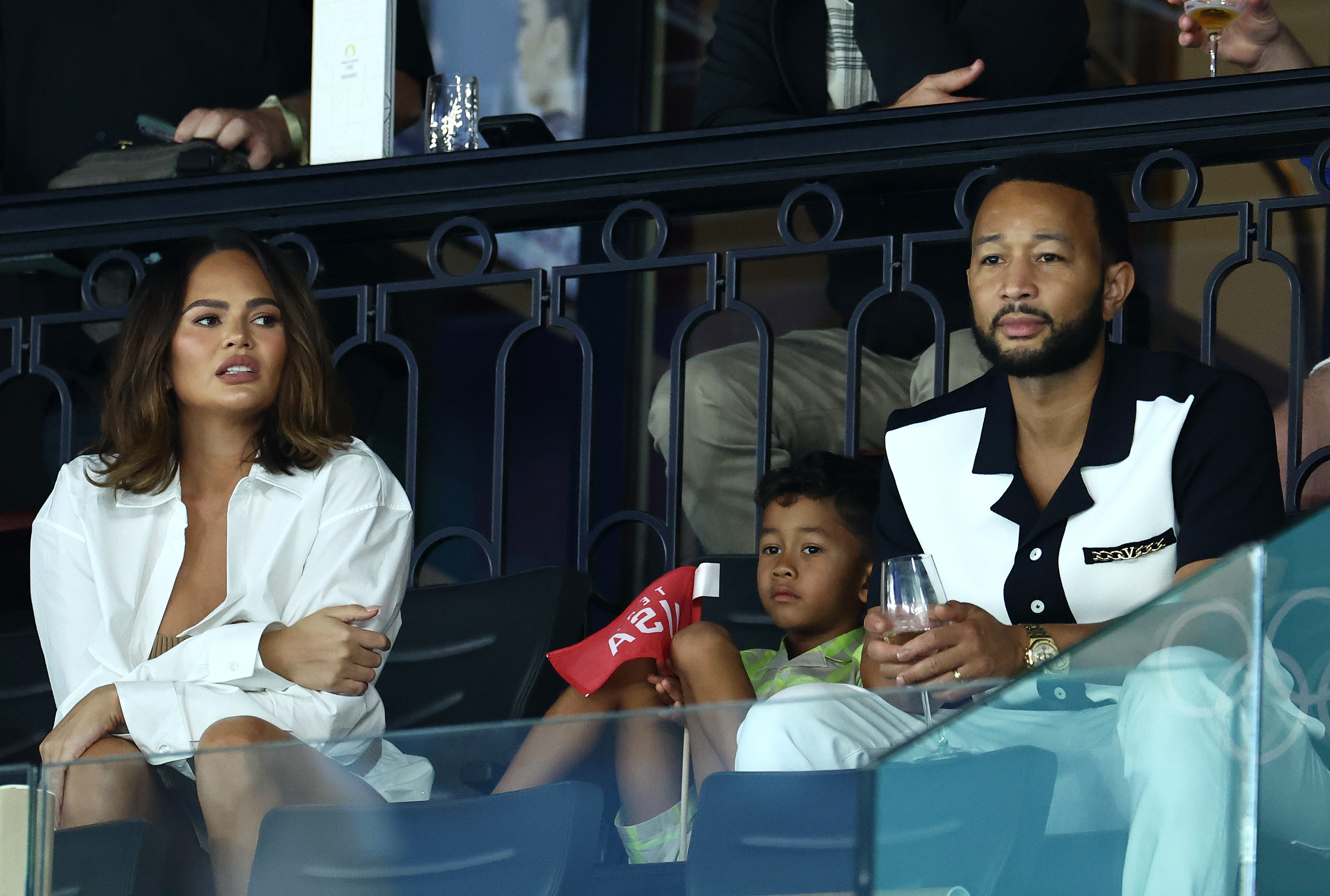 Chrissy Teigen, John Legend, and their son Miles attend the Artistic Gymnastics Women's Qualification at Bercy Arena during the 2024 Paris Olympic Games on July 28, 2024 | Source: Getty Images