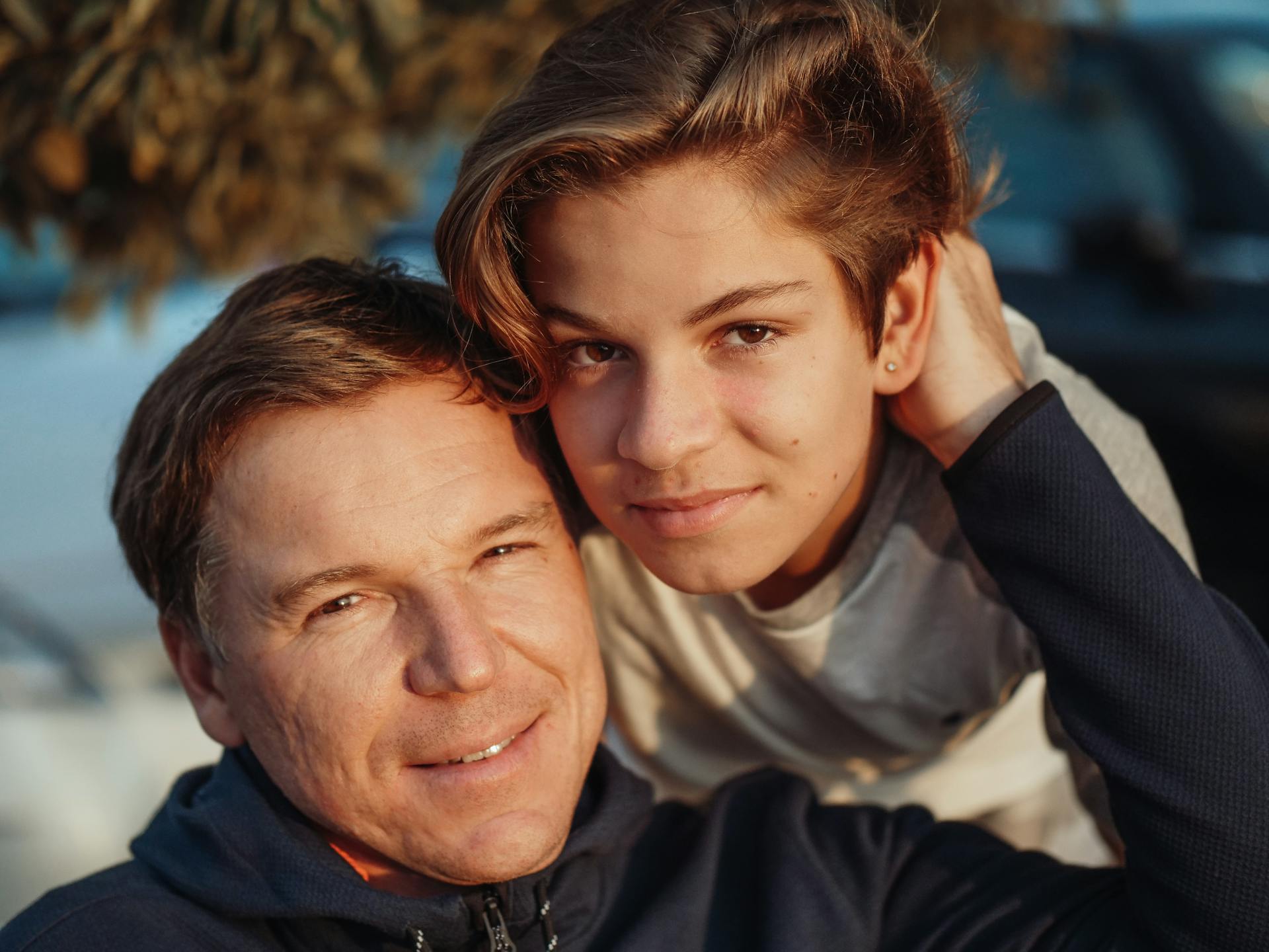 A boy with his father | Source: Pexels