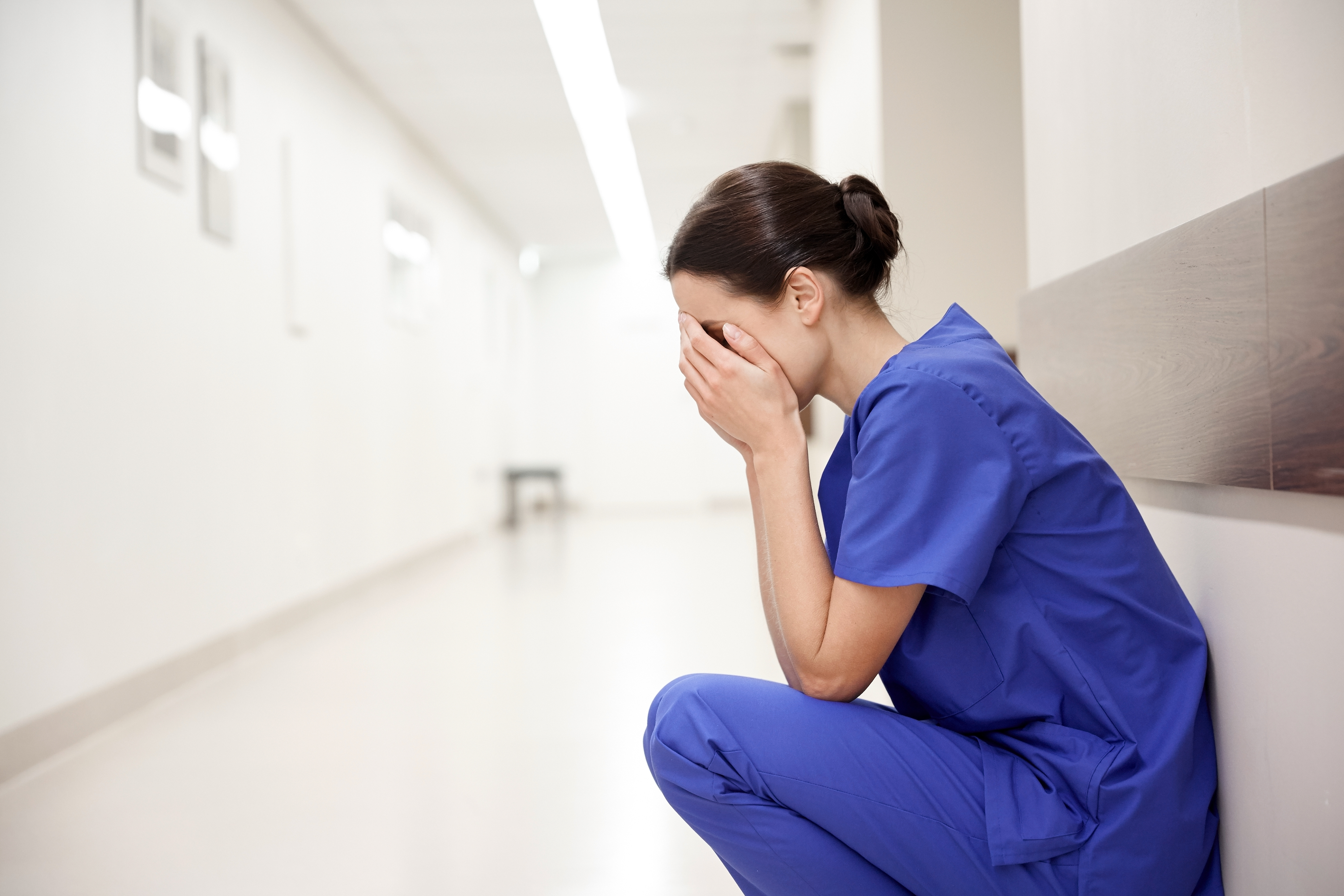 Crying female nurse at hospital | Source: Shutterstock
