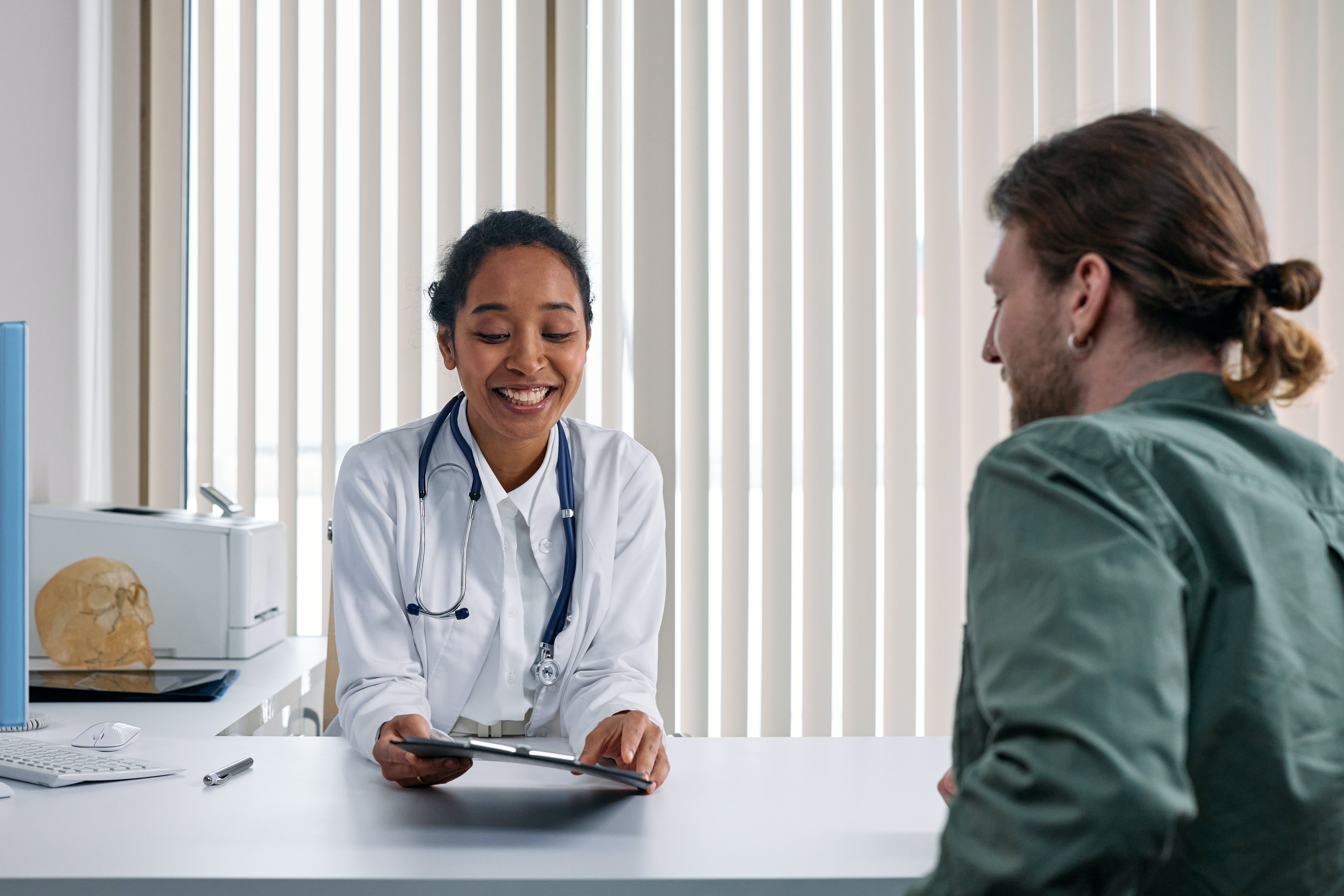 Doctor talking to a patient. | Source: Pexels