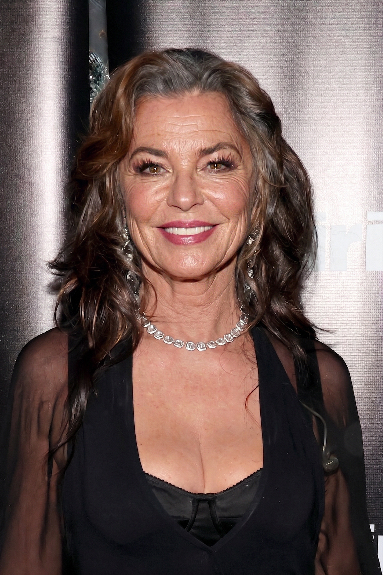 Simulating an unretouched look from July 23, 2026, this AI-generated rendering highlights Shania Twain's radiant smile alongside realistic forehead creases, defined marionette lines, and visible silver highlights. | Source: Gemini